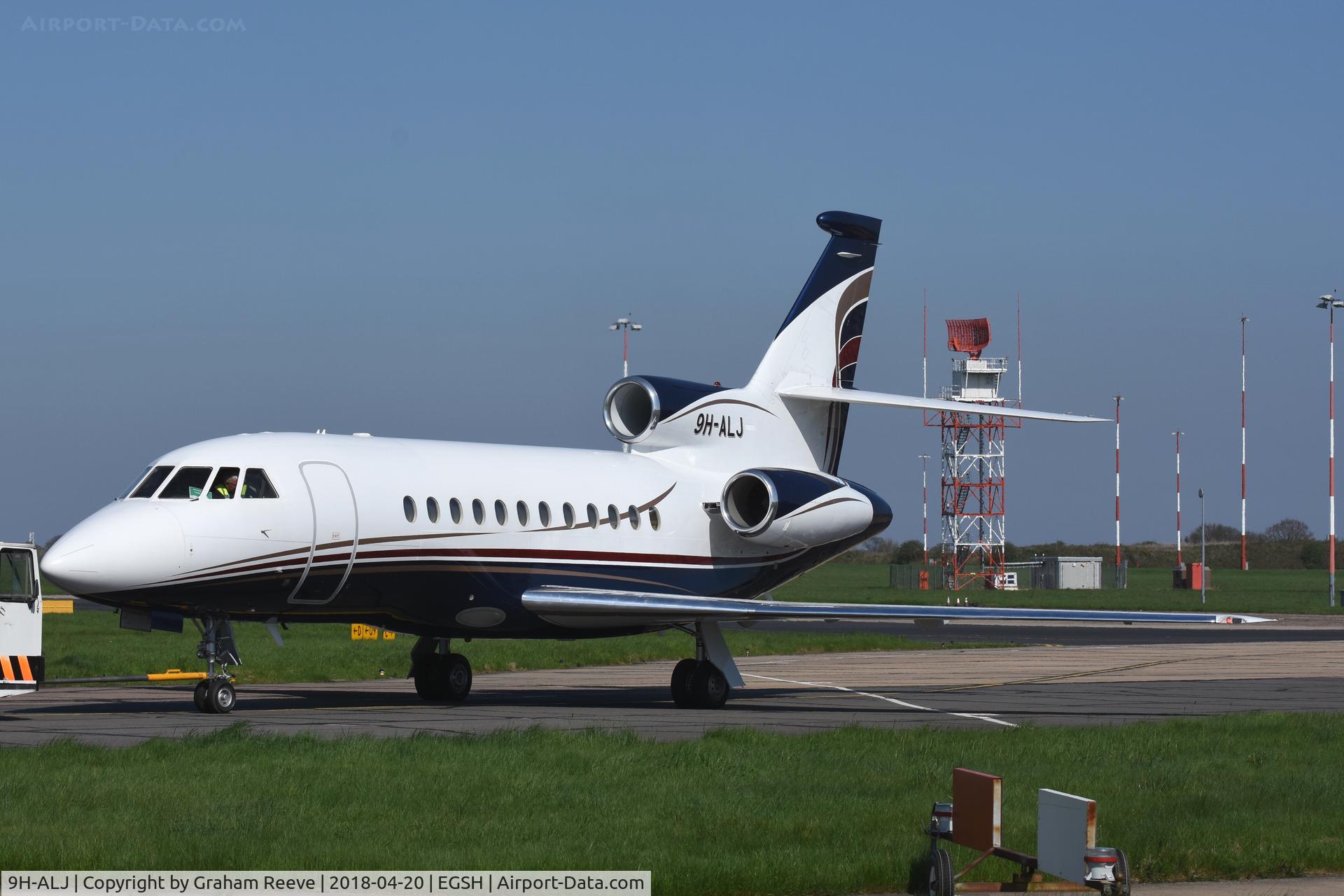 9H-ALJ, 2001 Dassault Falcon 900EX C/N 95, Under tow at Norwich.