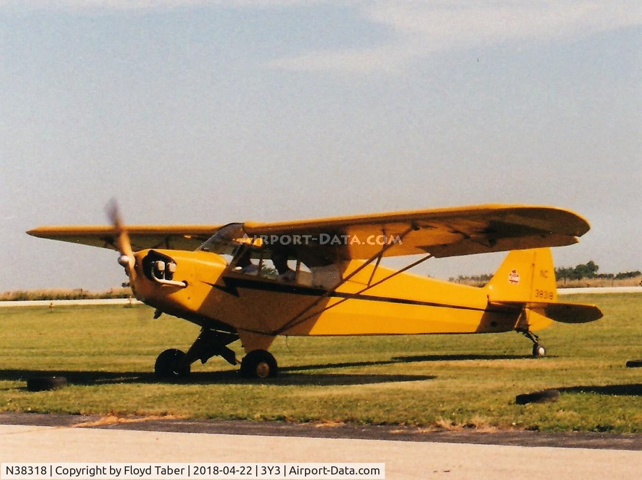 N38318, 1941 Piper J3L-65 Cub Cub C/N 6928, Warming up for a flight at 3y3 fly in summer of 1999