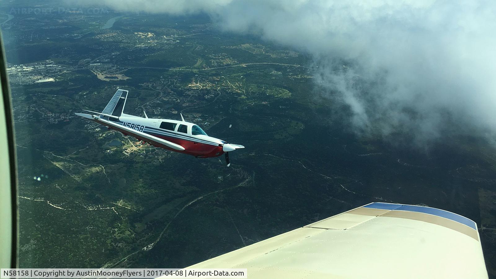 N58158, 1984 Mooney M20J 201 C/N 24-1509, Formation flying near Dripping Springs, TX.