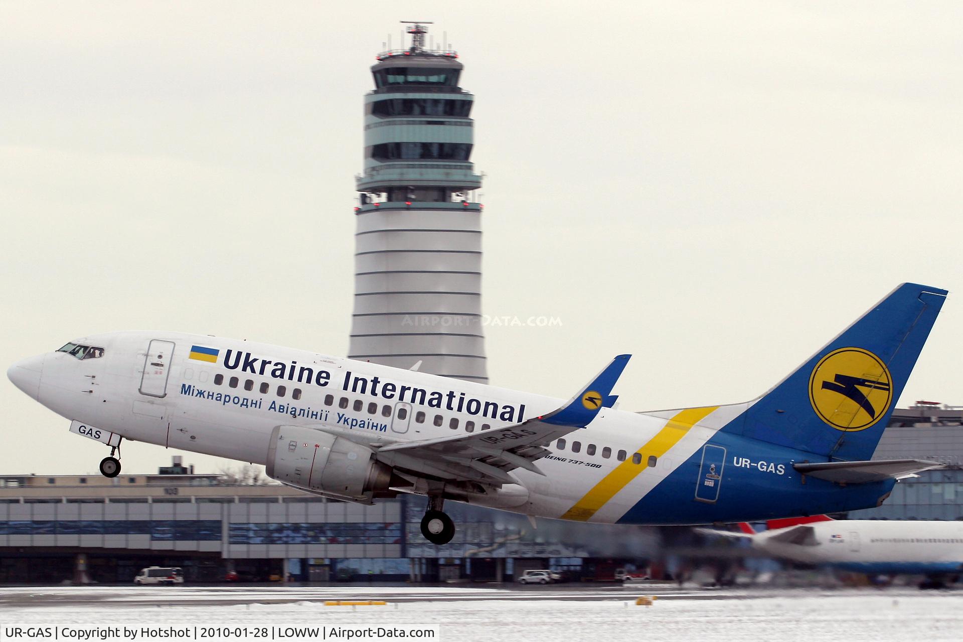 UR-GAS, 1993 Boeing 737-528 C/N 25236, With the ATC Tower in the backdrop