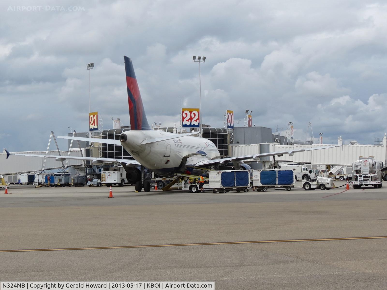 N324NB, 2001 Airbus A319-114 C/N 1456, Parked at Gate 22.