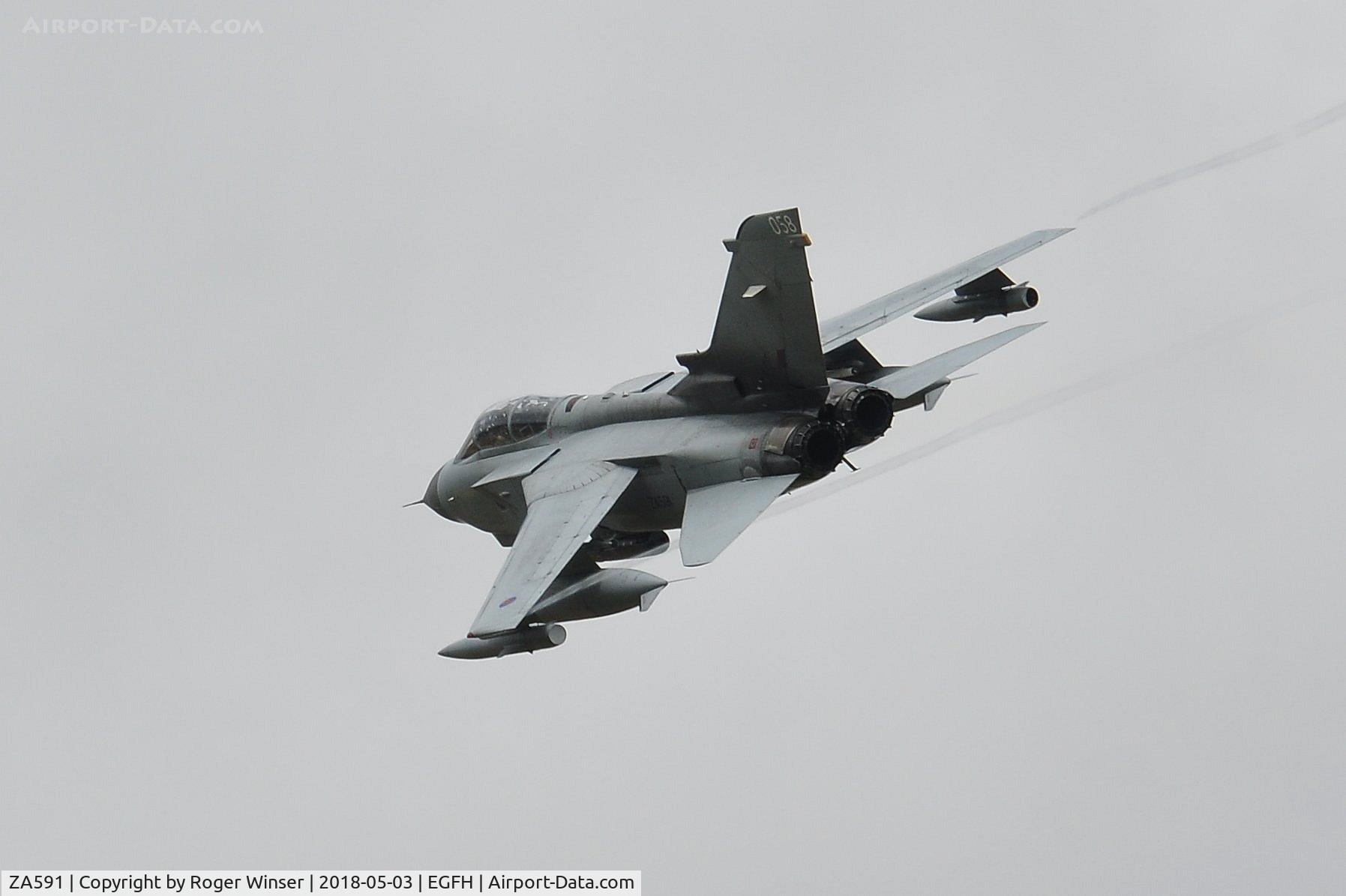 ZA591, 1982 Panavia Tornado GR.4 C/N 104/BS034/3055, RAF Tornado GR.4 aircraft coded 058 low over the airport.