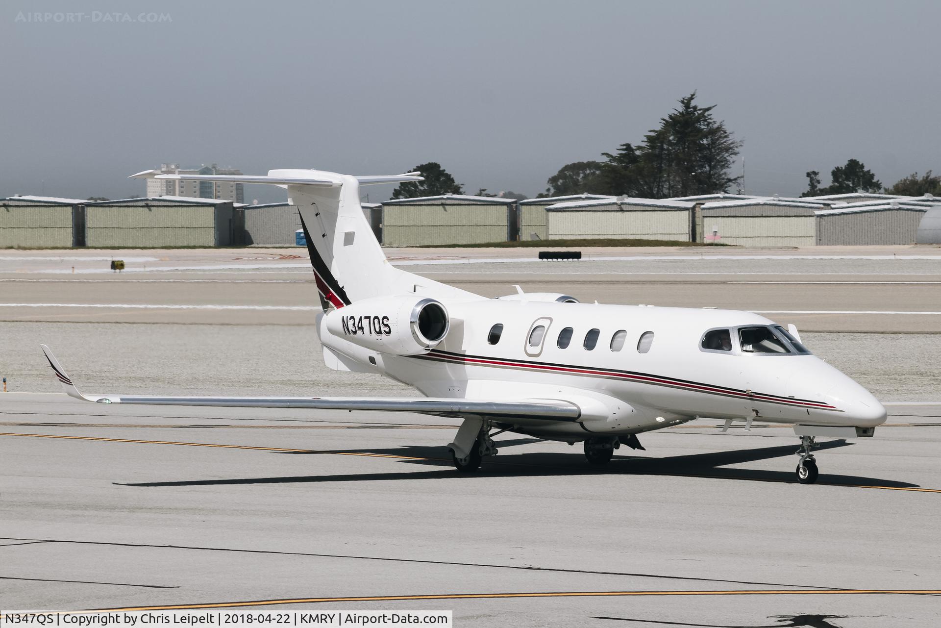 N347QS, 2014 Embraer EMB-505 Phenom 300 C/N 50500257, Net Jets Phenom 300 taxing out for departure at Monterey Regional Airport. Not a Citation Ultra.
