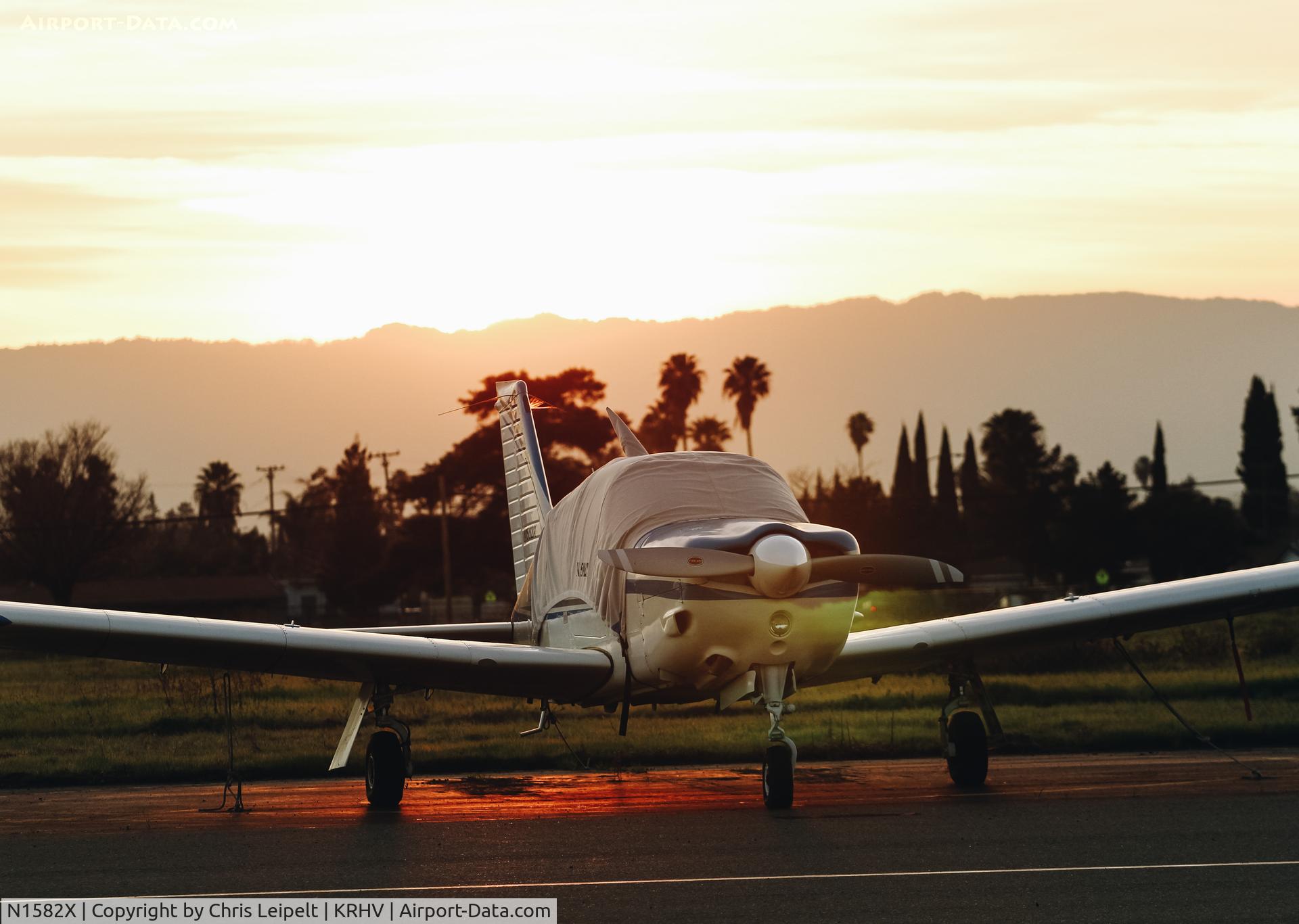N1582X, 1975 Piper PA-28R-200 Cherokee Arrow C/N 28R-7535340, Locally-based 1975 Piper PA-28R-200 parked at its tie down as the sun sets over Reid Hillview Airport, San Jose, CA.