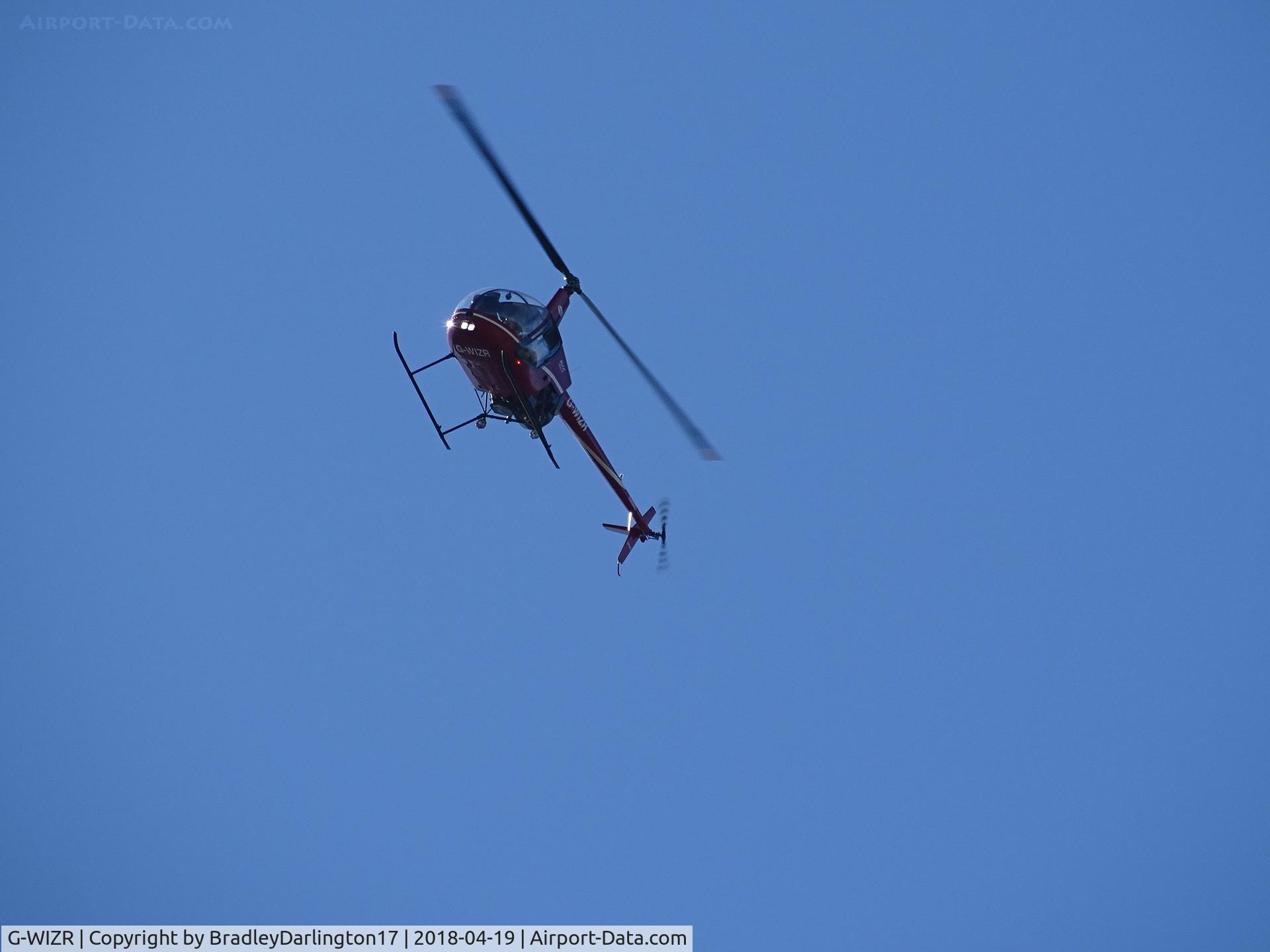 G-WIZR, 1998 Robinson R22 Beta II C/N 2799, doing mid air photos