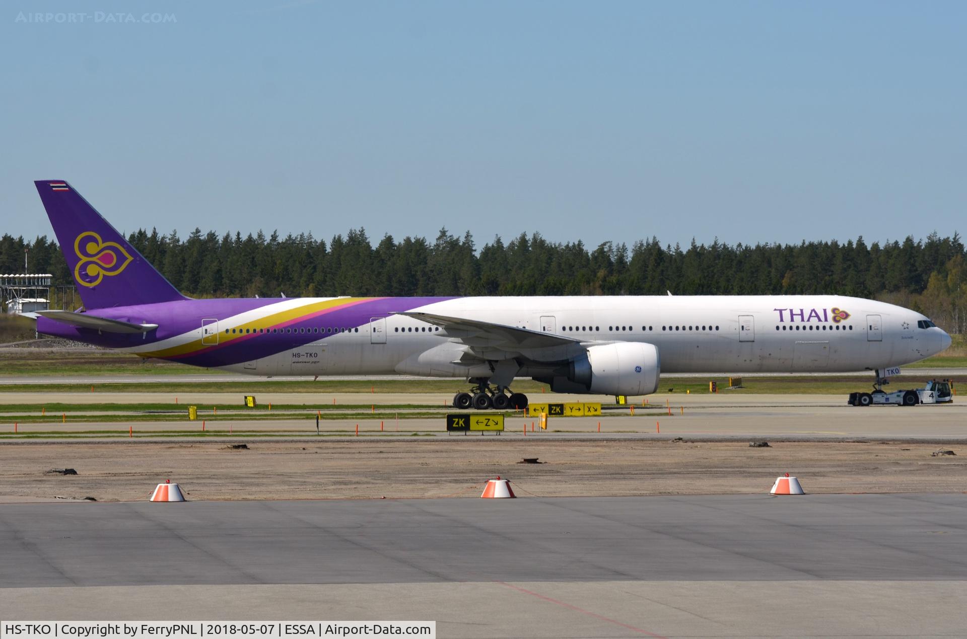 HS-TKO, 2013 Boeing 777-3AL/ER C/N 41524, Thai B773 tugged to its departure gate.