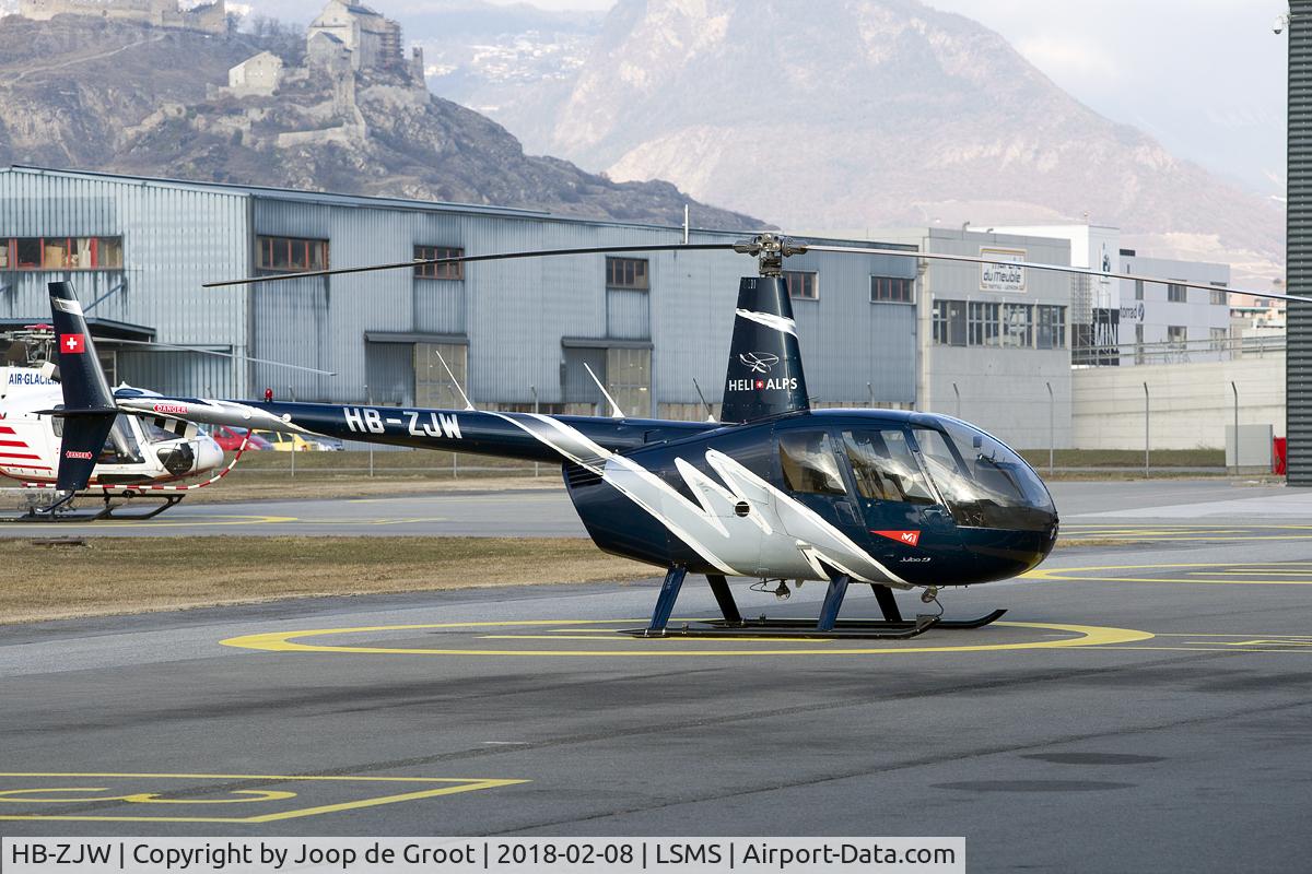 HB-ZJW, Robinson R44 Raven II C/N 12255, on the flightline of its home base.