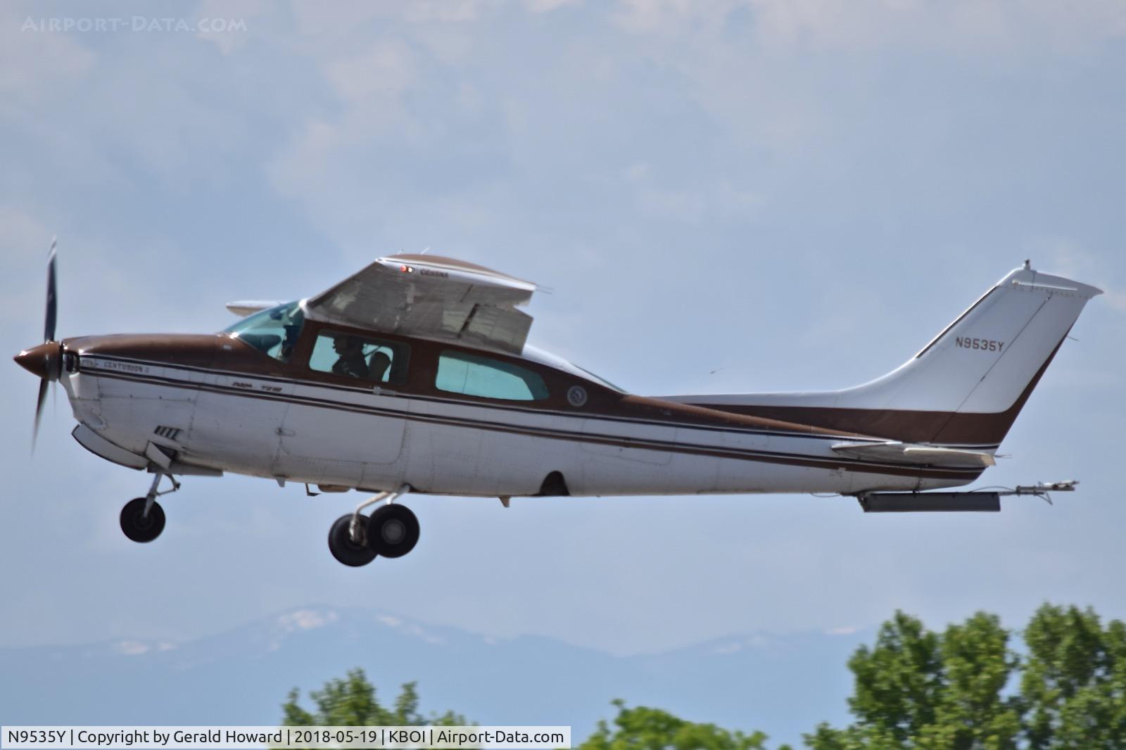N9535Y, 1981 Cessna T210N Turbo Centurion C/N 21064540, Climb out from RWY 10L. Not sure what is attached under the rudder.