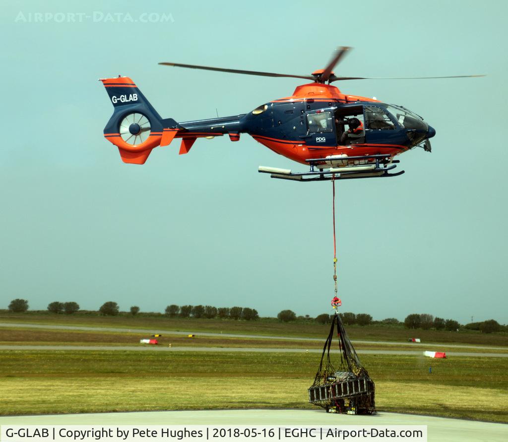 G-GLAB, 2008 Eurocopter EC-135T-2+ C/N 0712, G-GLAB EC135 lifting from Lands End with underslung load heading for one of the lighthouses.