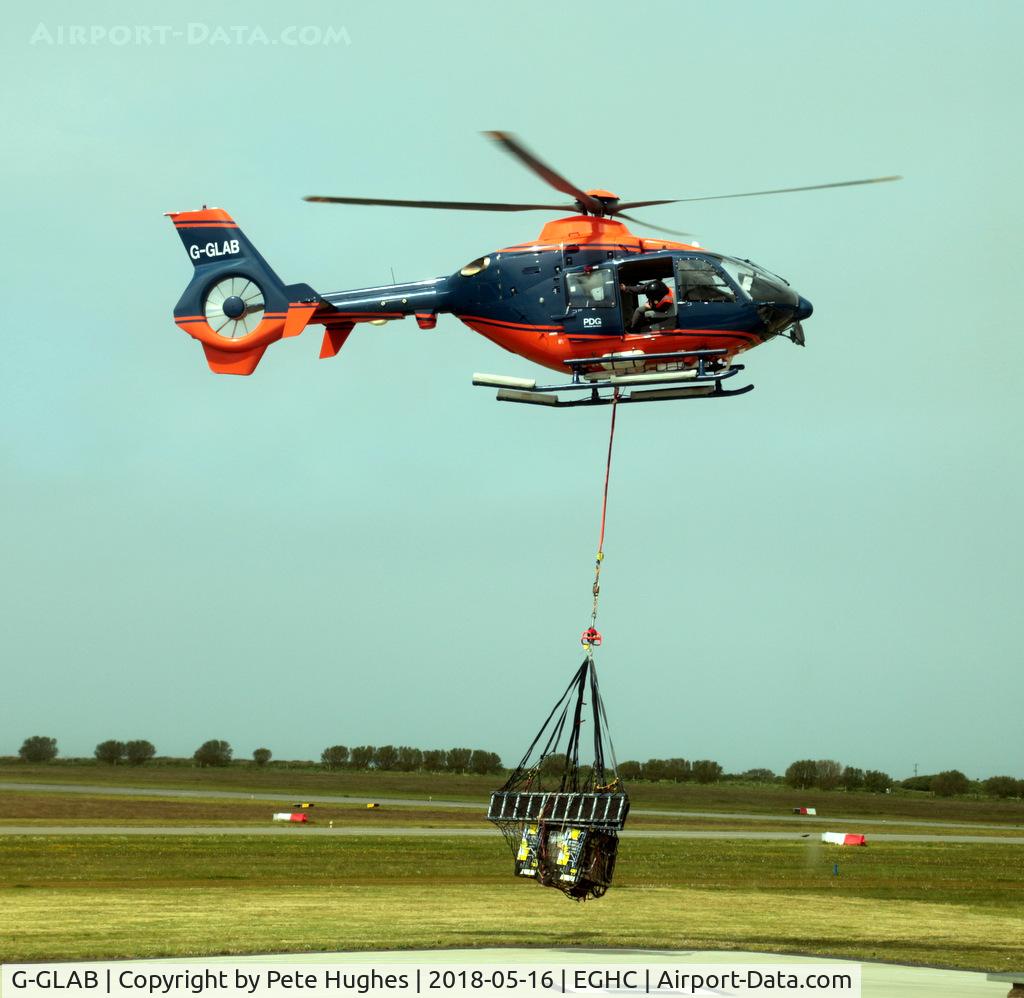 G-GLAB, 2008 Eurocopter EC-135T-2+ C/N 0712, G-GLAB EC135 lifting from Lands End with underslung load heading for one of the lighthouses.