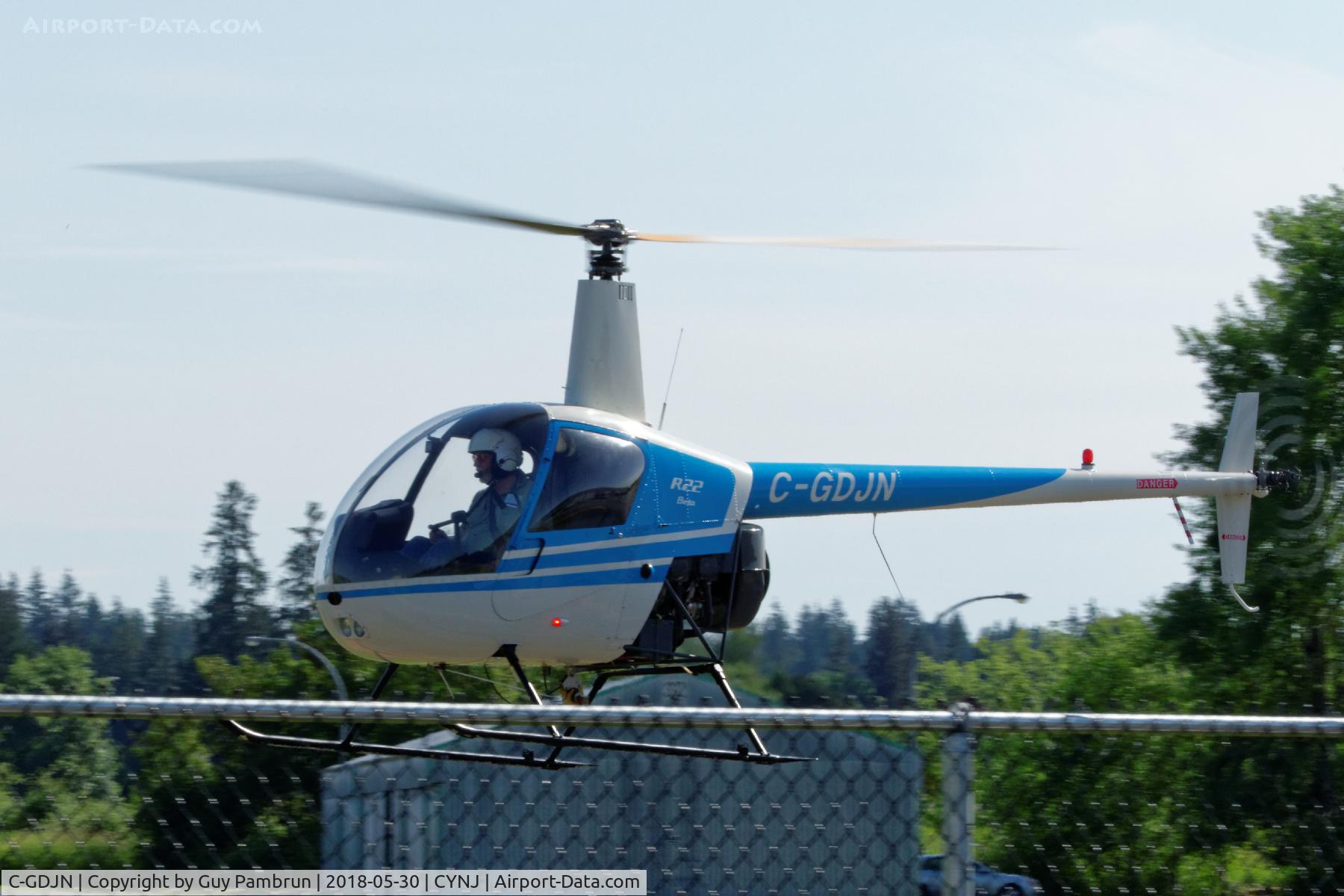 C-GDJN, 1991 Robinson R22 Beta C/N 1795, I think he's going to the fuel pumps but I'm not 100% certain