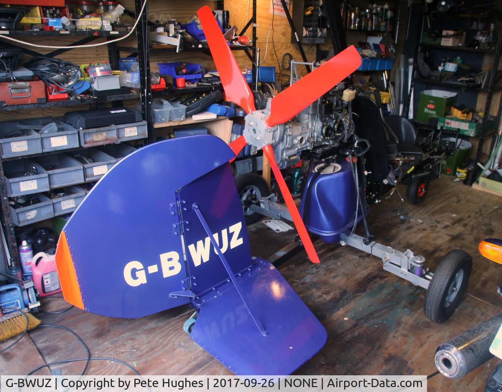 G-BWUZ, 1996 Campbell Cricket Replica C/N PFA G/03-1267, G-BWUZ Campbell Cricket in a garage 
