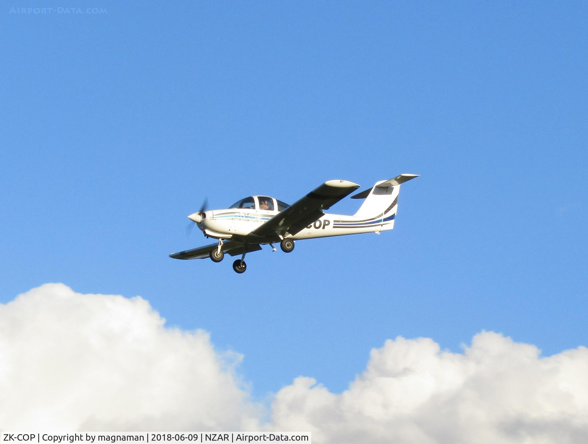 ZK-COP, Piper PA-38-112 Tomahawk Tomahawk C/N 38-79A0323, over threshold