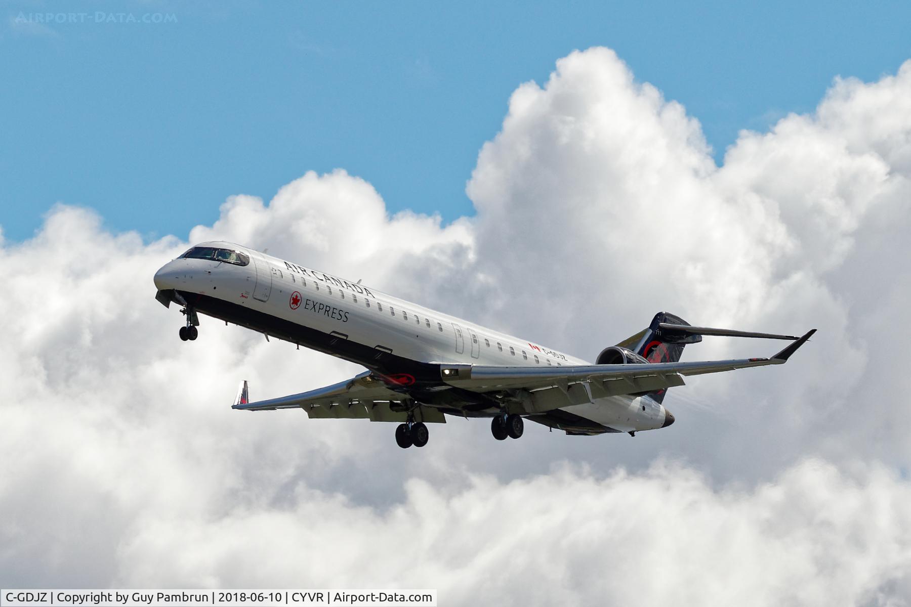 C-GDJZ, 2005 Canadair CRJ-705ER (CL-600-2D15) Regional Jet C/N 15049, Landing on 26R