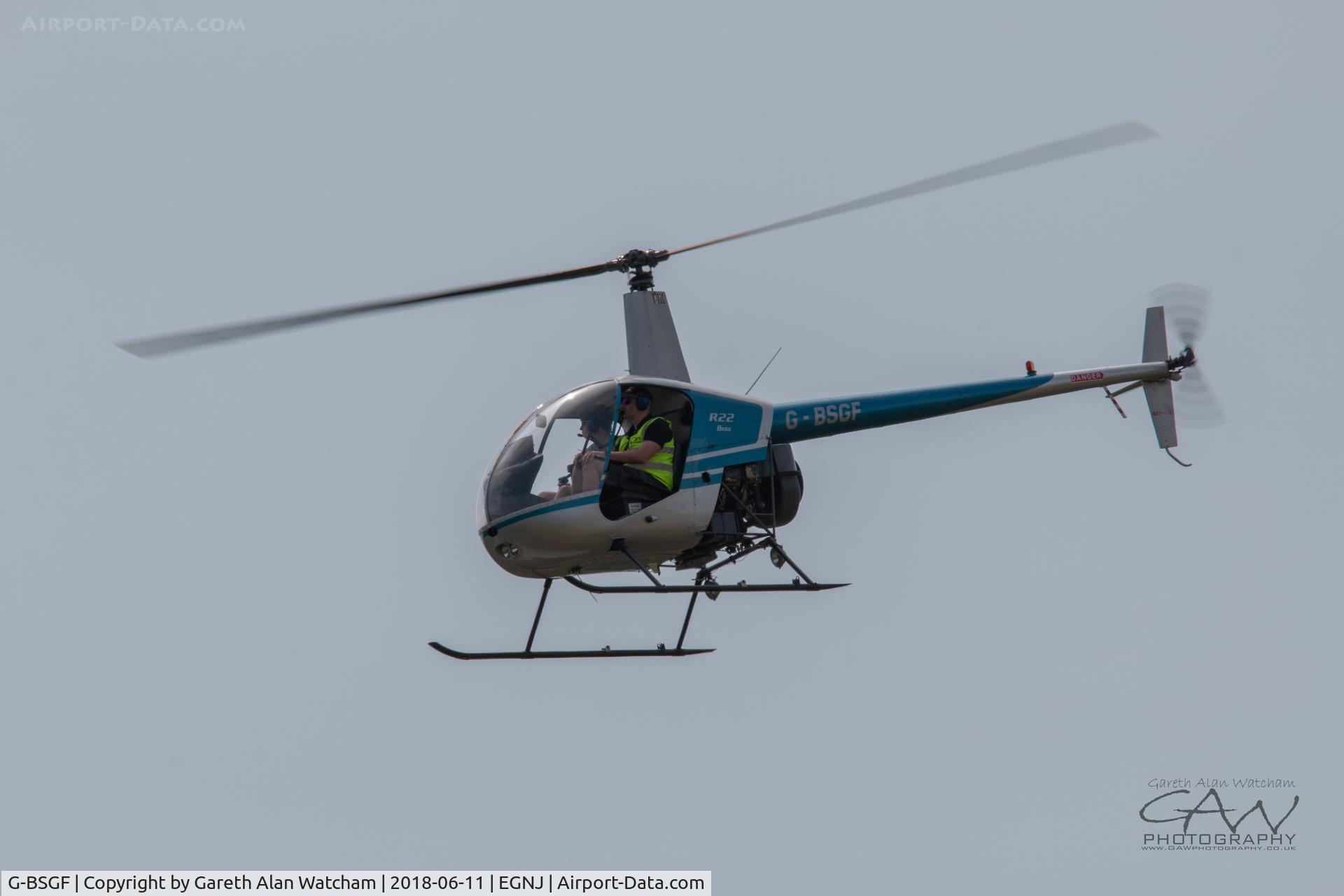 G-BSGF, 1990 Robinson R22 Beta C/N 1383, R22 takeoff from Runway 08 Humberside