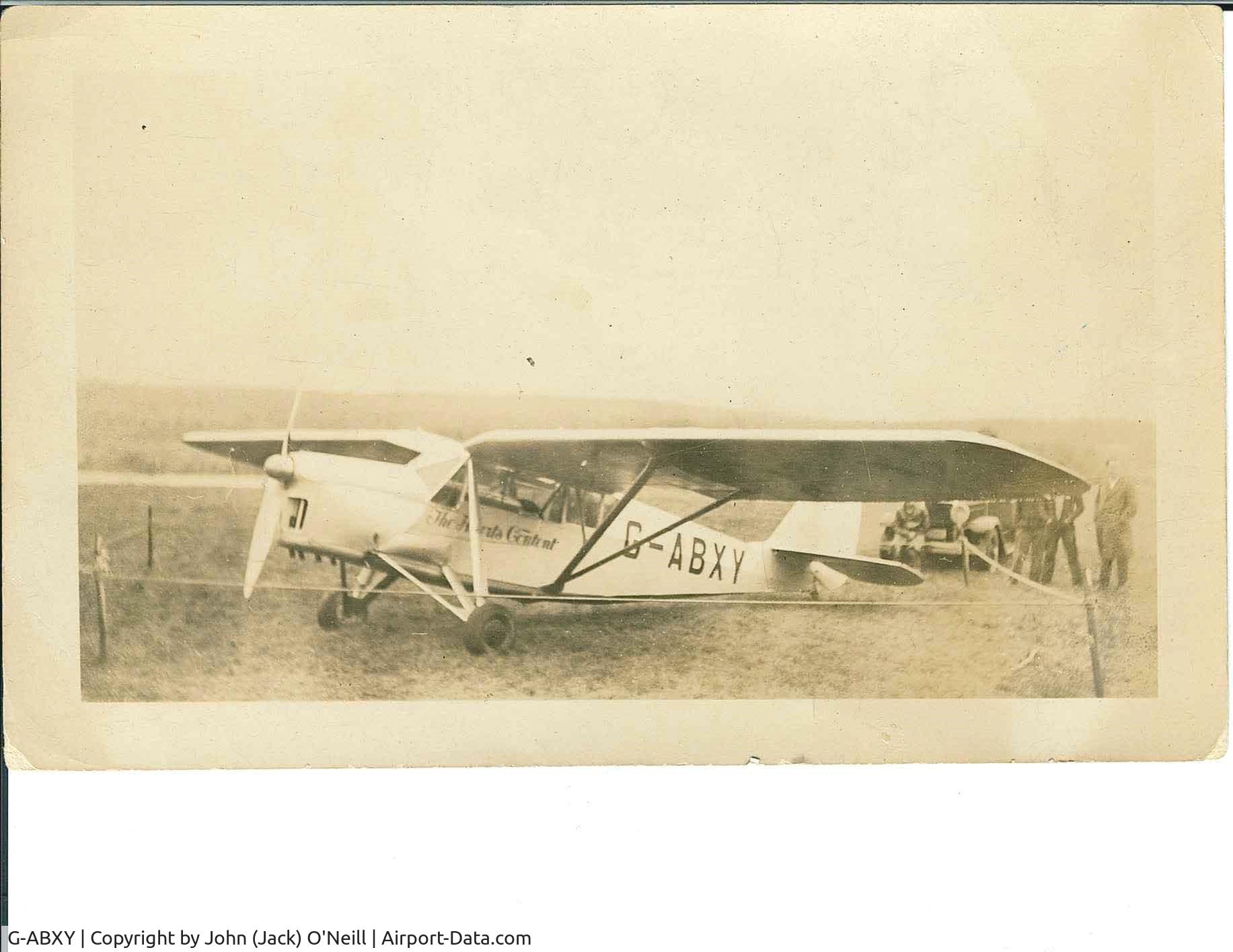 G-ABXY, De Havilland DH.80A Puss Moth C/N 2241, September 1932 in Saskatchewan, Canada. My grandfather John (Jack) O'Neill slept in the police car, parked behind, to guard the plane.