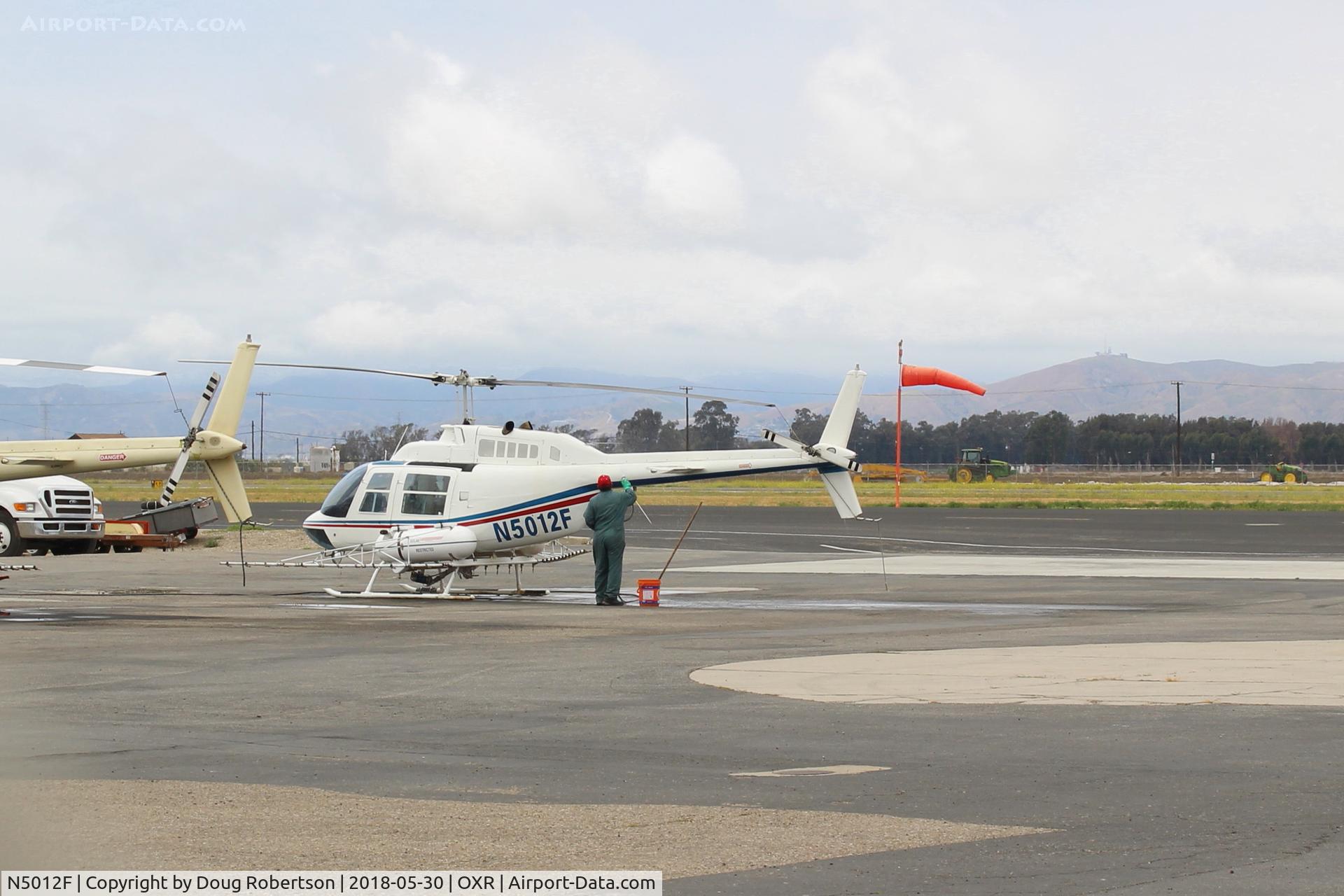 N5012F, 1978 Bell 206B-3 JetRanger III, C/N 2559, 1978 Bell 206B-3 JetRanger III, one Allison 250-C20B TurboShaft, 420 SHp, note tank & spray rig, other side same, thorough washing after return from crop dusting-aerial application. at Aspen Helicopters ramp