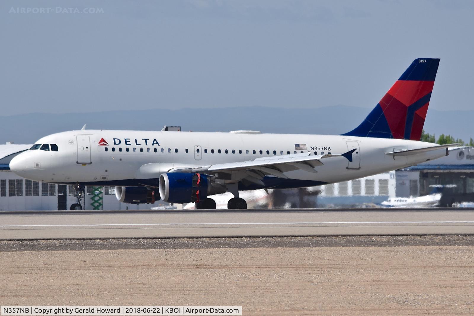 N357NB, 2002 Airbus A319-114 C/N 1875, Landing RWY 10R. Reverse thrusters out.