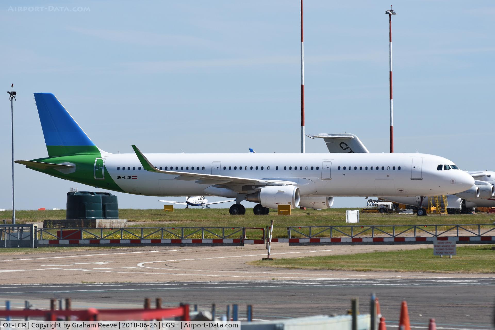 OE-LCR, 2015 Airbus A321-211 C/N 6719, Parked at Norwich with airline logo covered up.