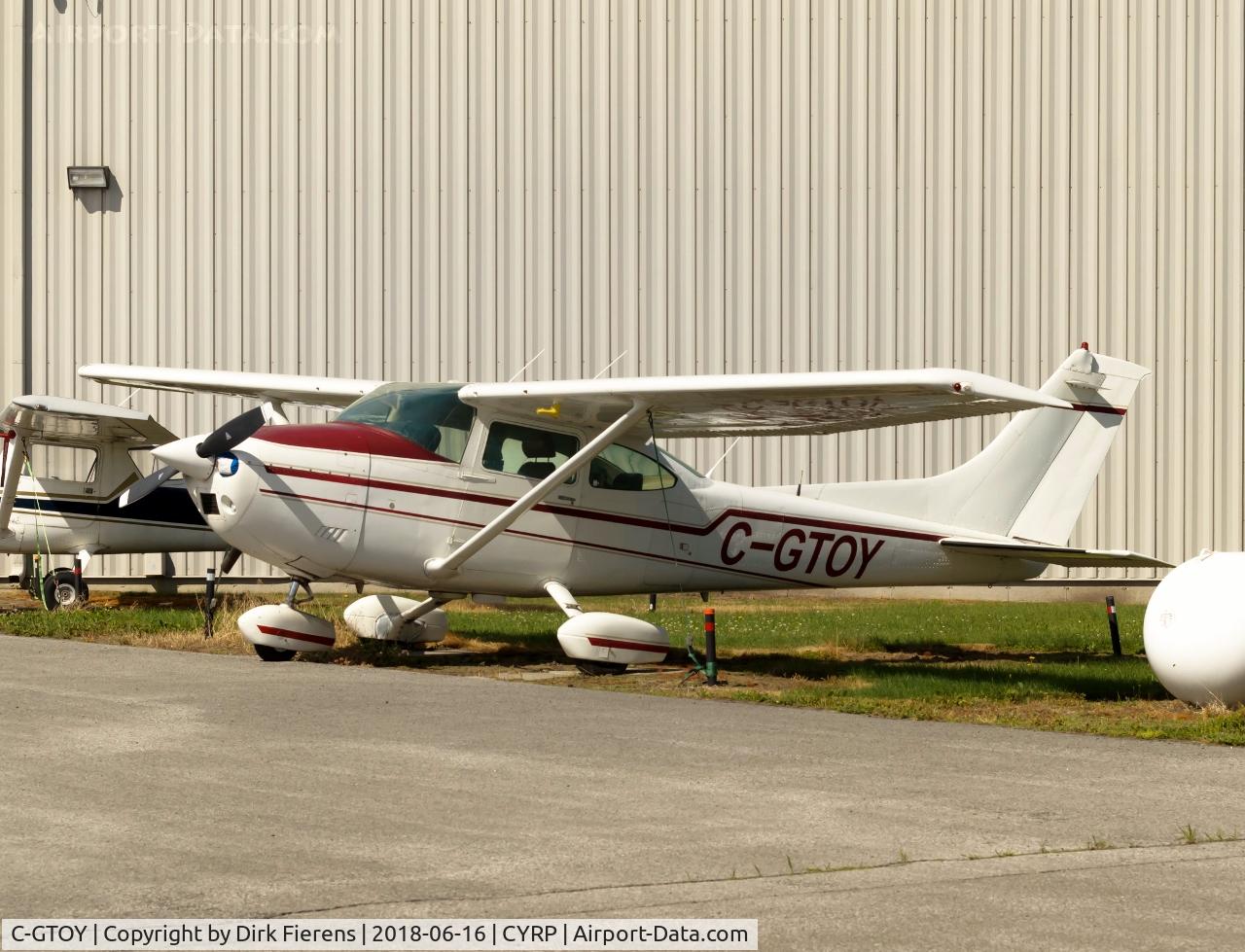 C-GTOY, 1977 Cessna 182Q Skylane C/N 18265725, Parked in front of hangar.