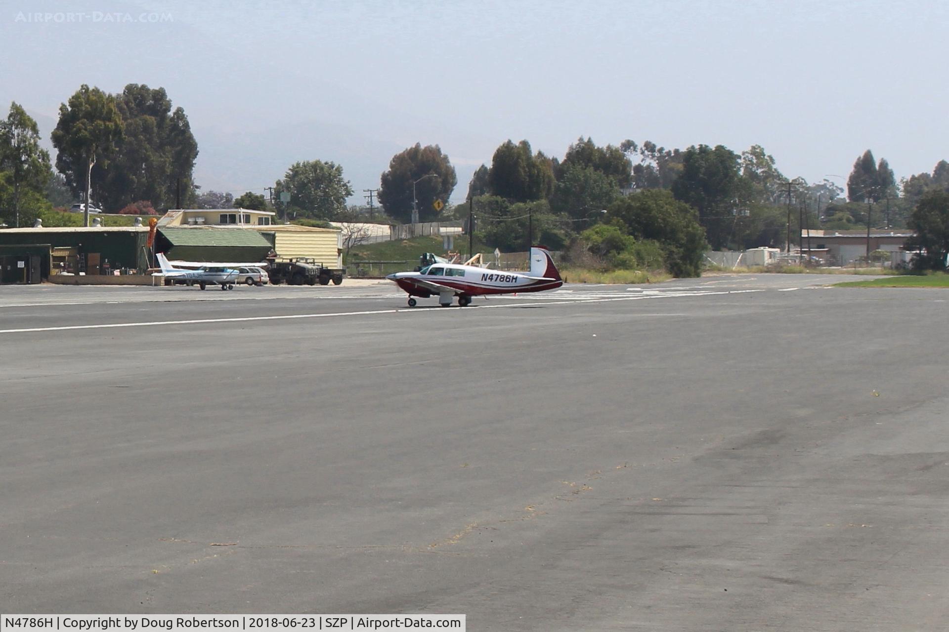 N4786H, 1979 Mooney M20J 201 C/N 24-0876, 1979 Mooney M20J 201, Lycoming IO-360 A&C 200 Hp, crossing Rwy 22 to runup area.