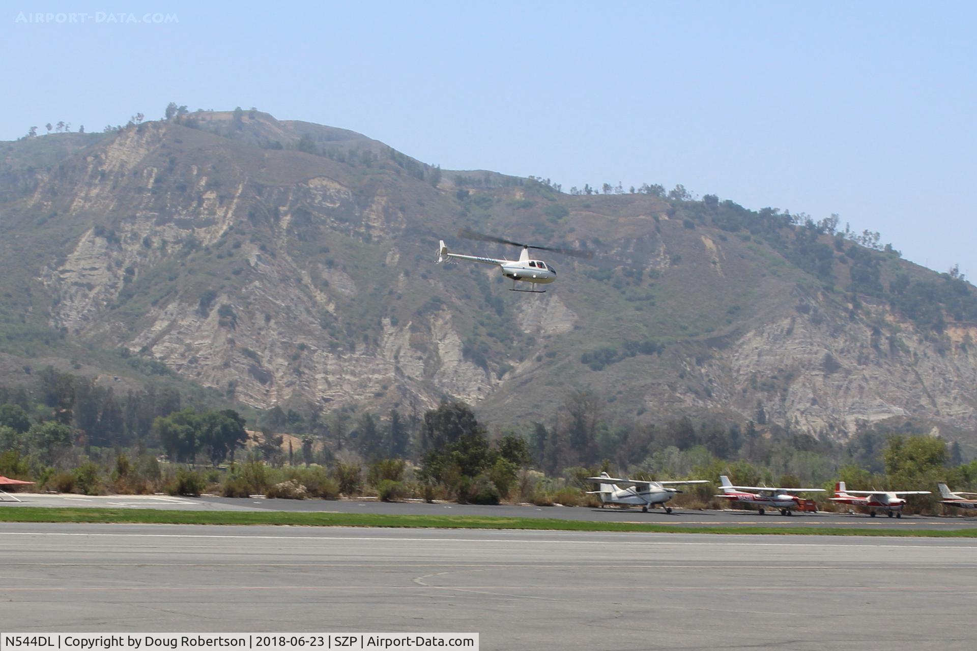 N544DL, 2005 Robinson R44 Raven II C/N 10783, 2005 Robinson R44 RAVEN II, Lycoming IO-540-AE1A5 260 Hp derated to 225 Hp for takeoff, 205 Hp continuous, approaching home hangar at SZP