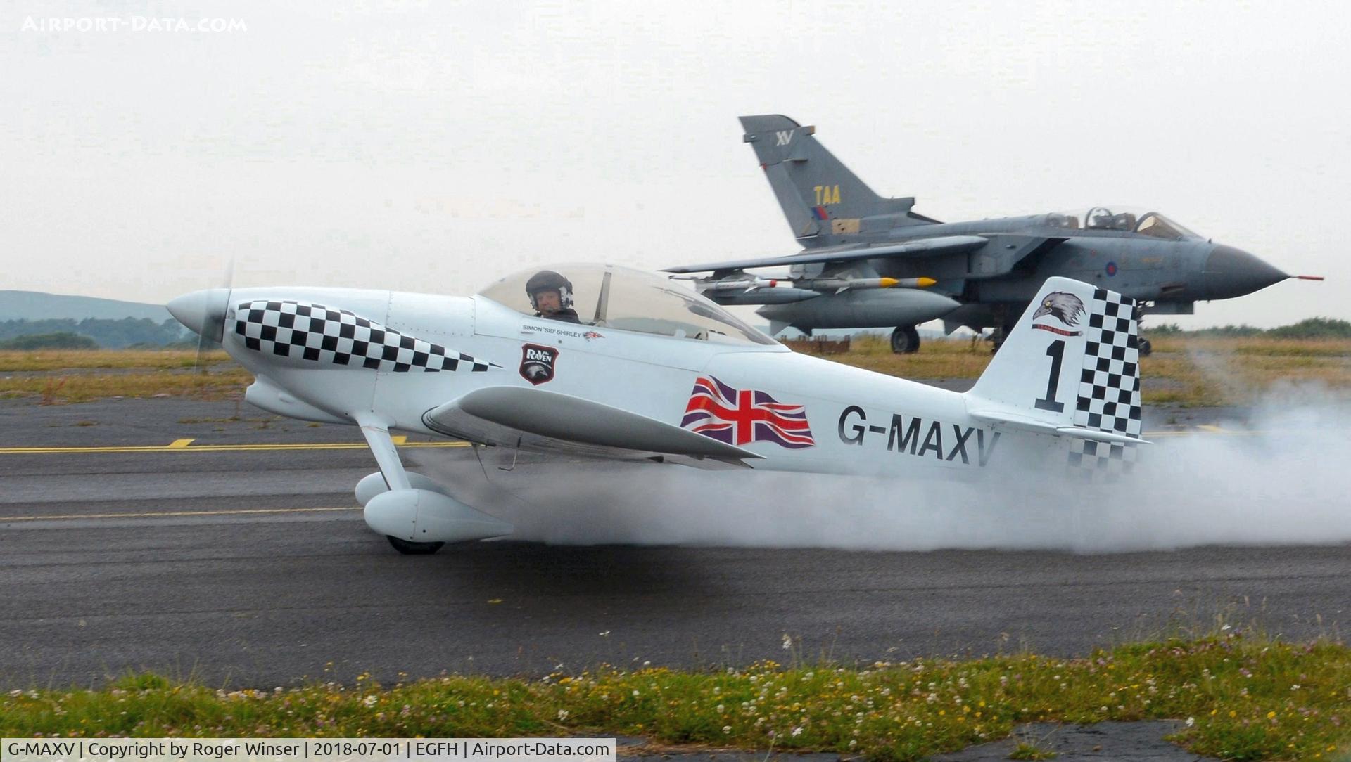 G-MAXV, 2000 Vans RV-4 C/N PFA 181-13266, Raven 1 returning after leading the 5-ship Team Raven formation aerobatic display on day 2 of WNAS18. Former RAF Tornado GR.1A aircraft ZA355 in the background.