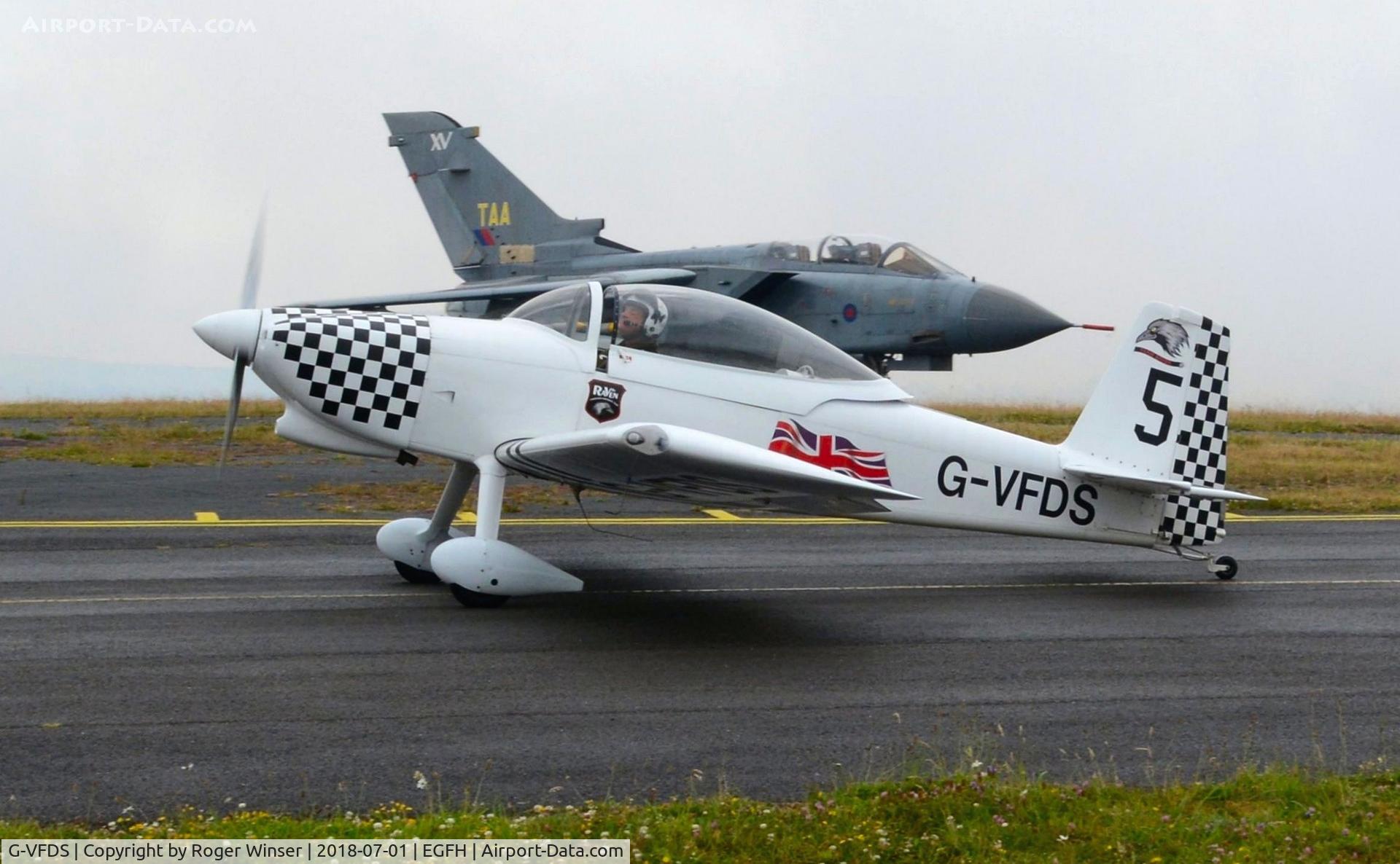 G-VFDS, 2012 Vans RV-8 C/N PFA 303-14637, Raven 5 returning after displaying with 5-ship Team Raven on day 2 of WNAS18. Former RAF Tornado GR.1A aircraft ZA355 in the background.