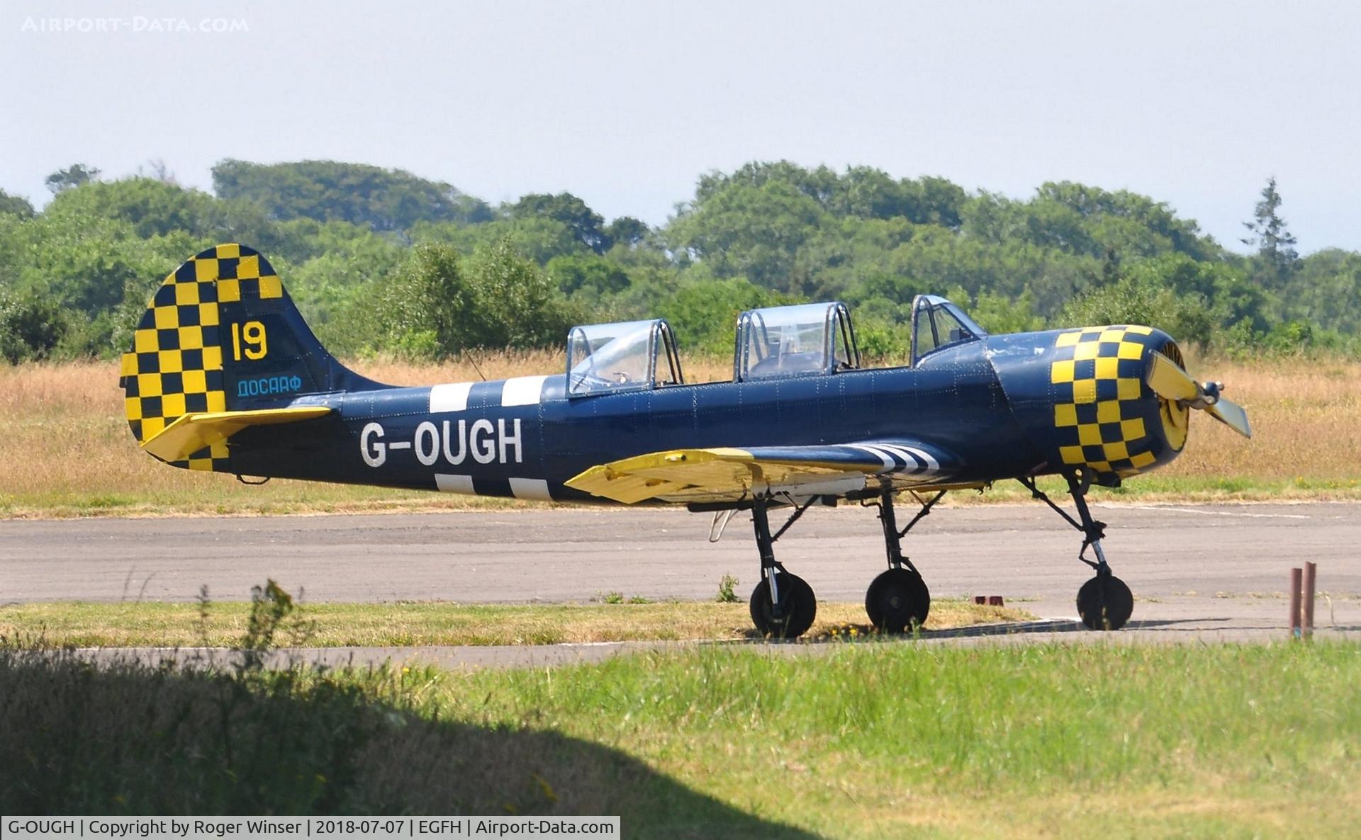 G-OUGH, 1987 Bacau Yak-52 C/N 877404, Resident Yak-52 in revised markings of DOSAAF/Yellow 19 as carried when the aircraft entered service in Russia circa 1987.