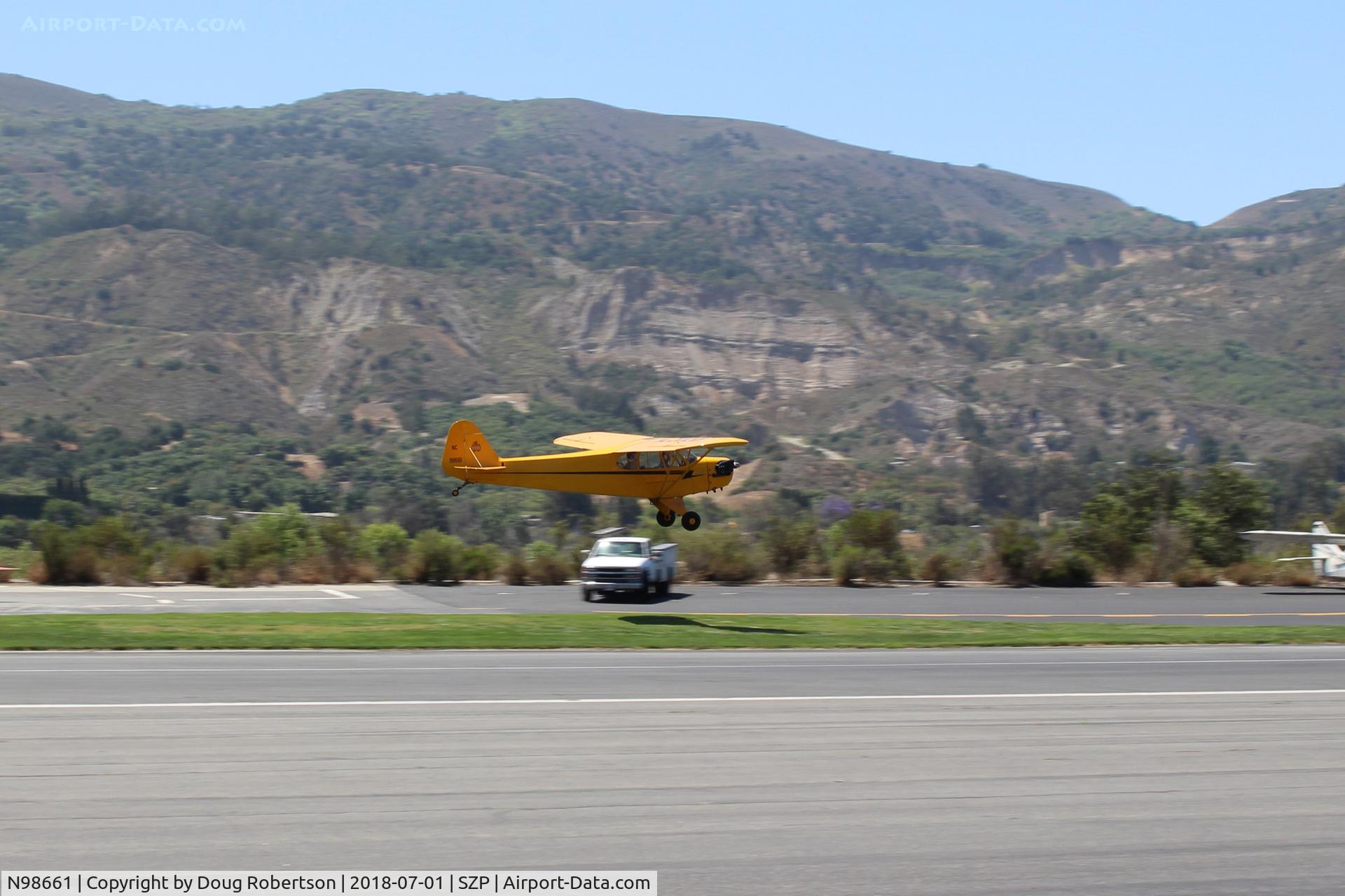 N98661, 1946 Piper J3C-65 Cub Cub C/N 18890, 1946 Piper J3C-65 CUB, Continental A&C75 75 Hp upgrade by STC, on final Rwy 22L grass