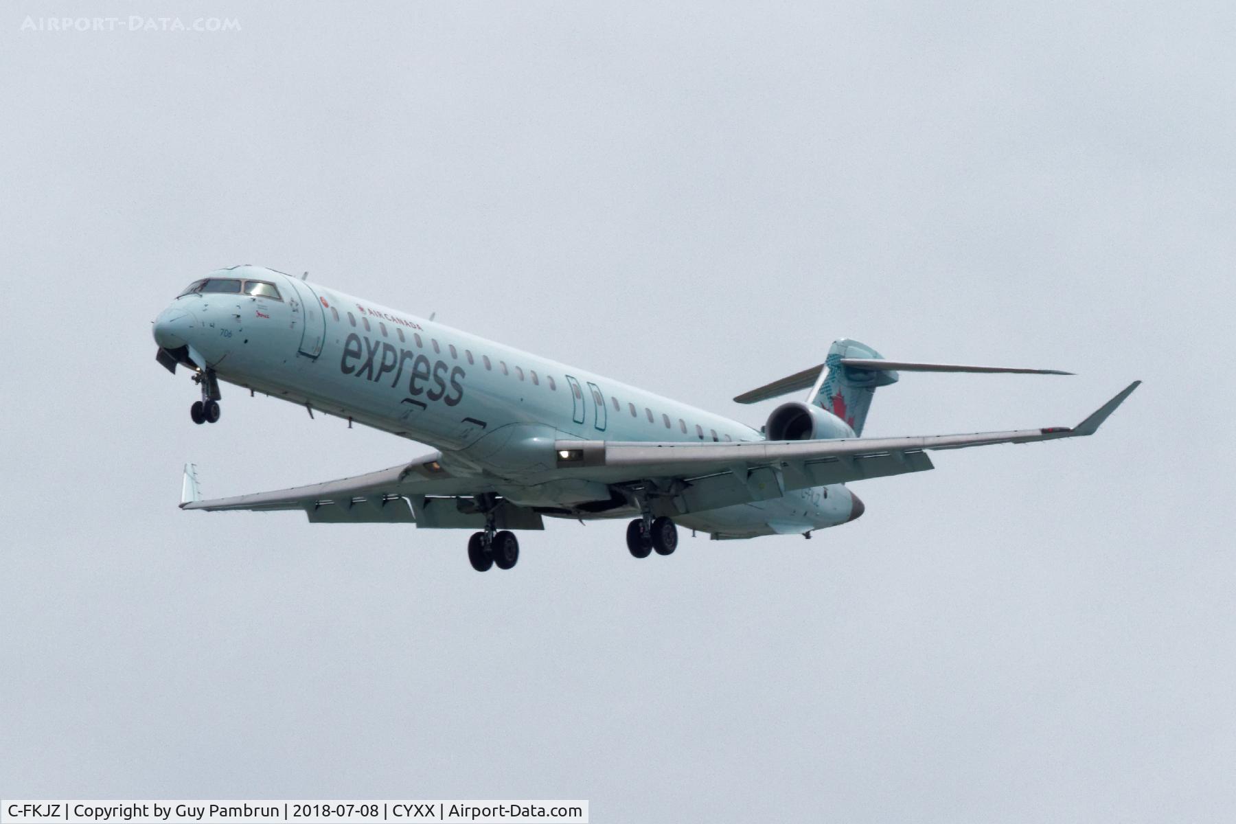 C-FKJZ, 2005 Canadair CRJ-705ER (CL-600-2D15) Regional Jet C/N 15044, Landing on 26R