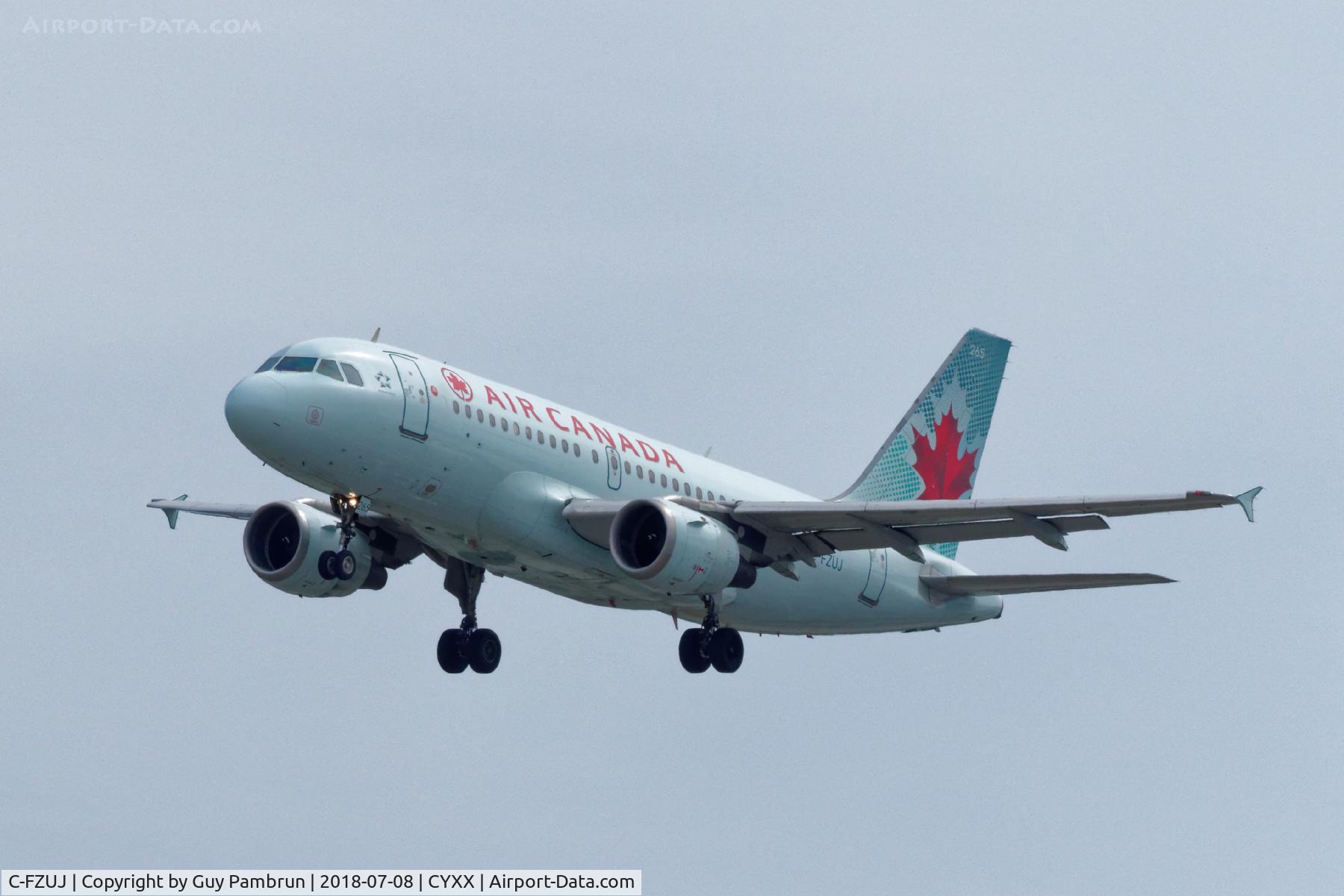 C-FZUJ, 1997 Airbus A319-114 C/N 719, Landing on 26R