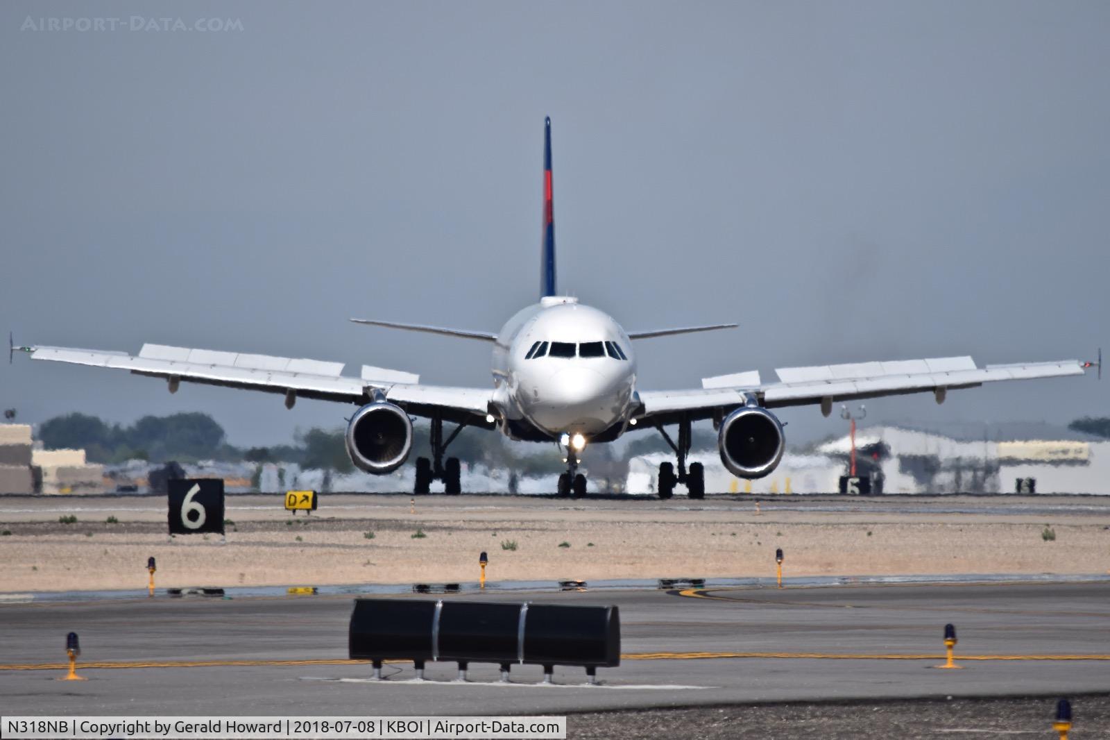 N318NB, 2000 Airbus A319-114 C/N 1325, Turning off RWY 10L onto Delta.