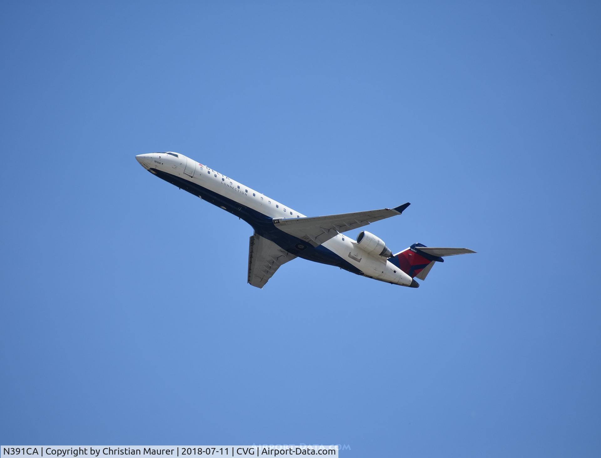 N391CA, 2003 Bombardier CRJ-701ER (CL-600-2C10) Regional Jet C/N 10108, CRJ-700ER departing to the north