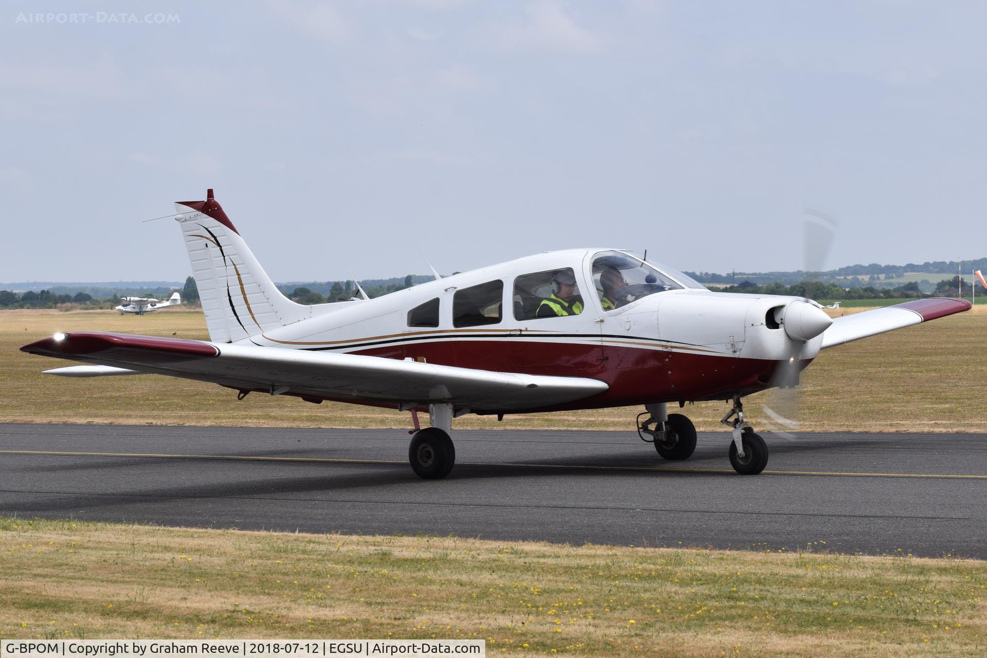 G-BPOM, 1984 Piper PA-28-161 Cherokee Warrior II C/N 28-8416118, Departing from Duxford.