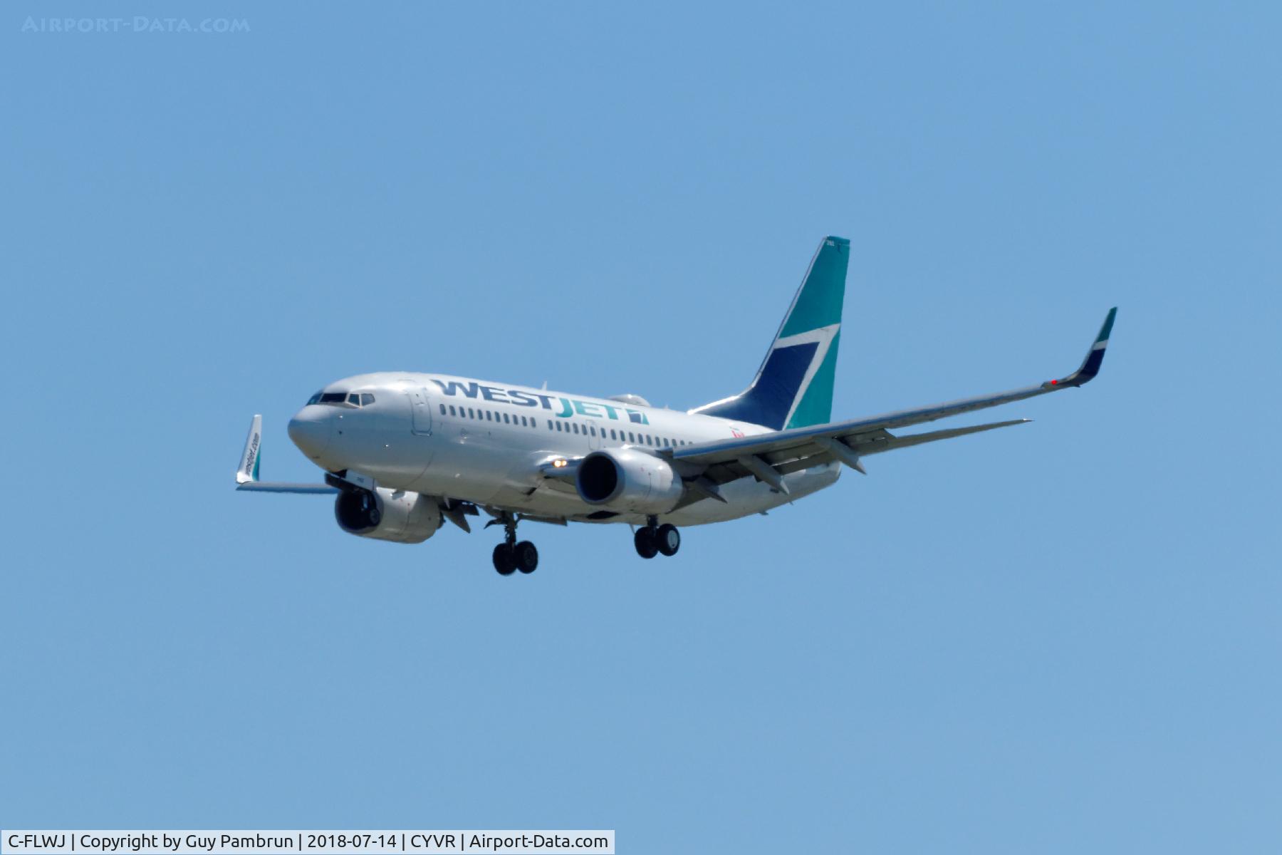 C-FLWJ, 2011 Boeing 737-7CT C/N 38096, Landing on 26R