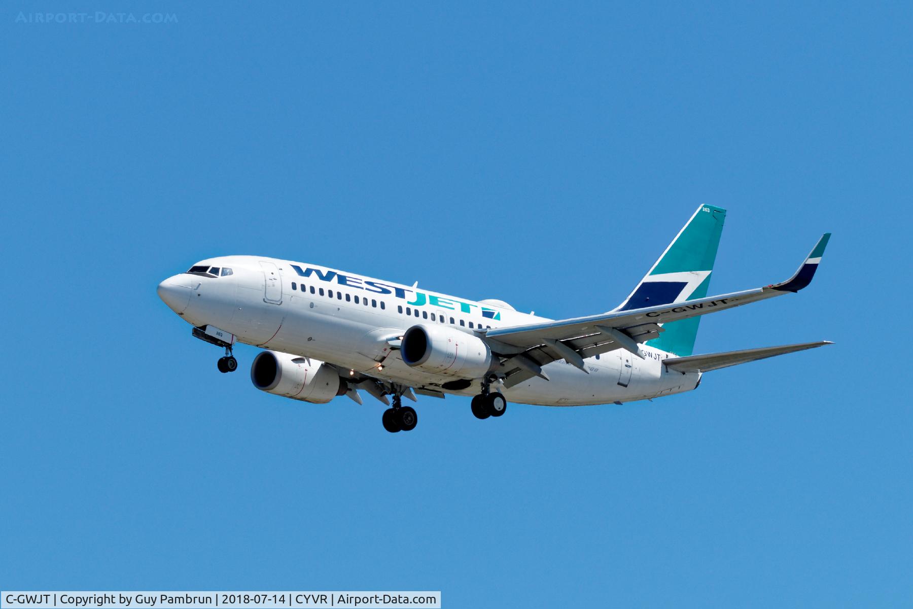 C-GWJT, 2011 Boeing 737-7CT C/N 40338, Landing on 26R