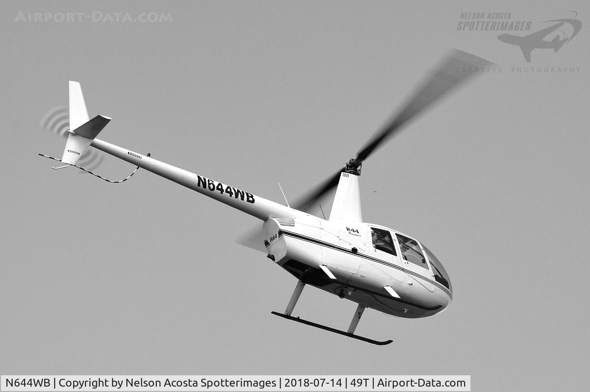 N644WB, Robinson R44 II C/N 12499, Departing the Dallas Convention Center rooftop Helipad.