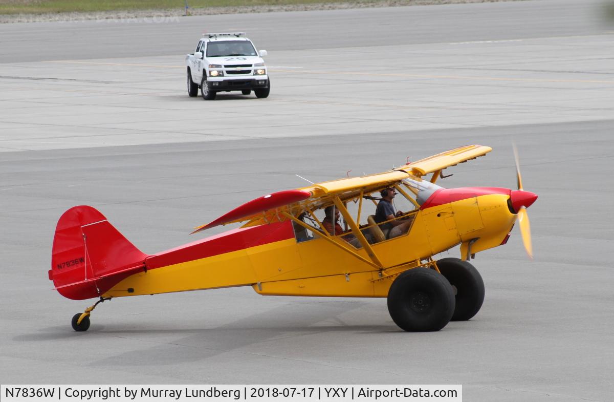N7836W, 2014 Piper PA-18 Super Cub Replica C/N TCQ1302087, Arriving from Alaska, taxiing to the Canada Customs clearance area at Whitehorse. Note the new cargo pod.