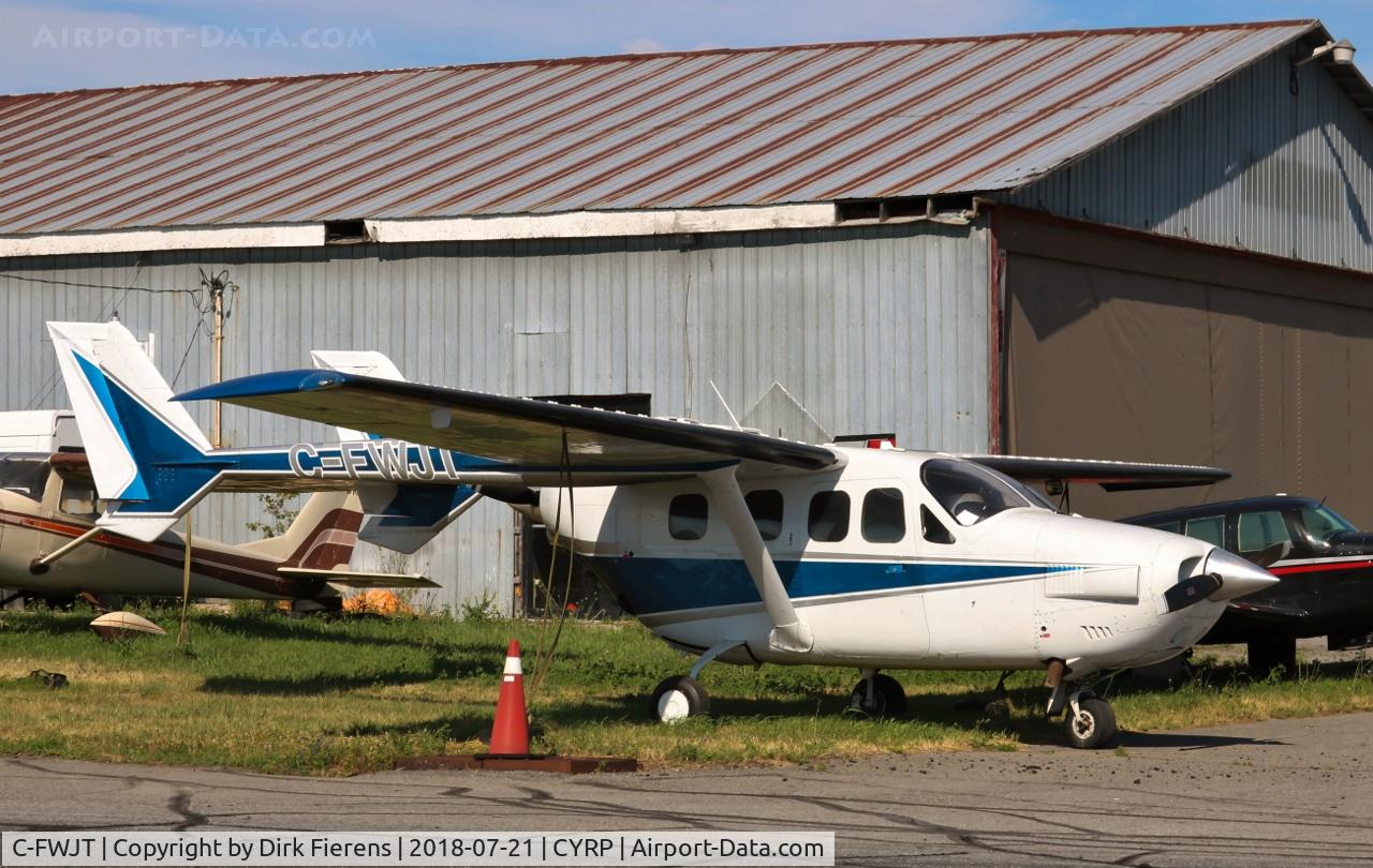 C-FWJT, 1979 Cessna P337H Pressurized Skymaster C/N P337-0341, Parked at the side of bldg.