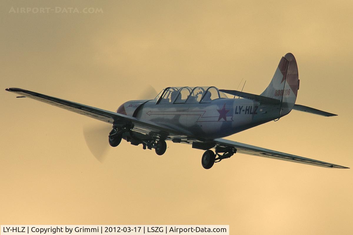 LY-HLZ, 1983 Yakovlev Yak-52 C/N 833206, late afternoon takeoff