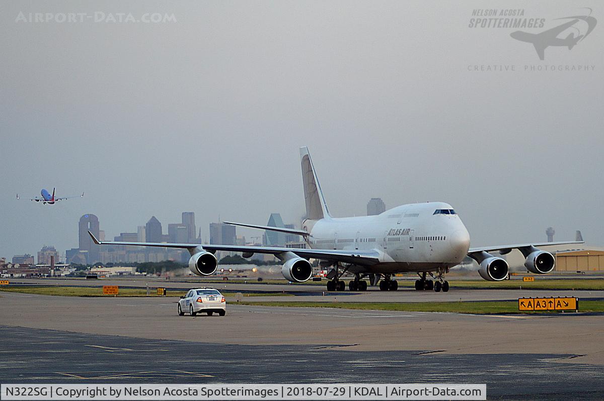 N322SG, 2000 Boeing 747-481 C/N 30322, Moving the FC Barcelona team from Los Angeles to Dallas. The queen is seen on the taxiway with the Dallas Skyline displaying itself proudly in the rear.