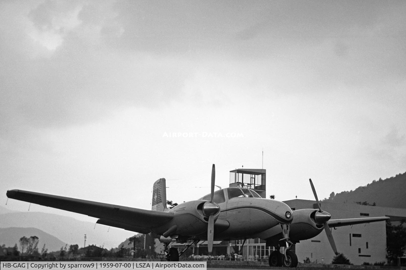HB-GAG, 1955 Beech C-50 Twin Bonanza C/N CH-182, At Lugano-Agno. It looks quite different there nowadays. Scanned from a 6x9 b+w-negative.