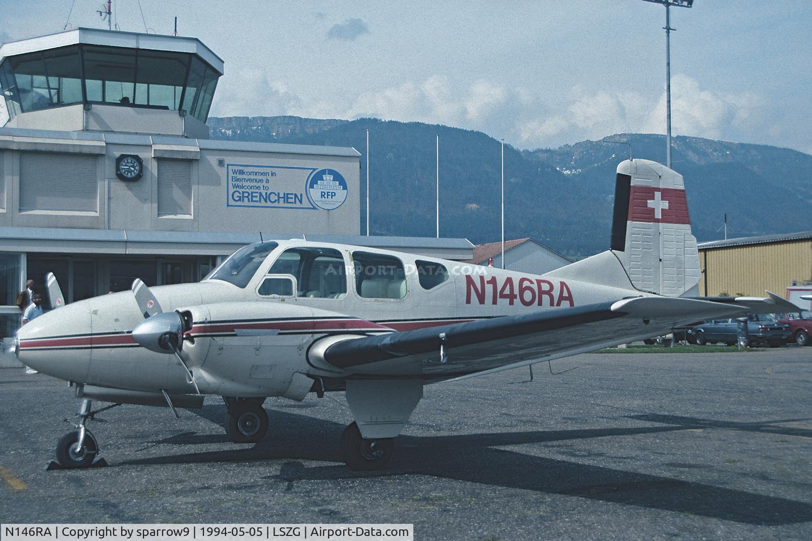 N146RA, 1959 Beech 95 Travel Air C/N TD-294, In front of the newer tower at Grenchen. Scanned from a slide.