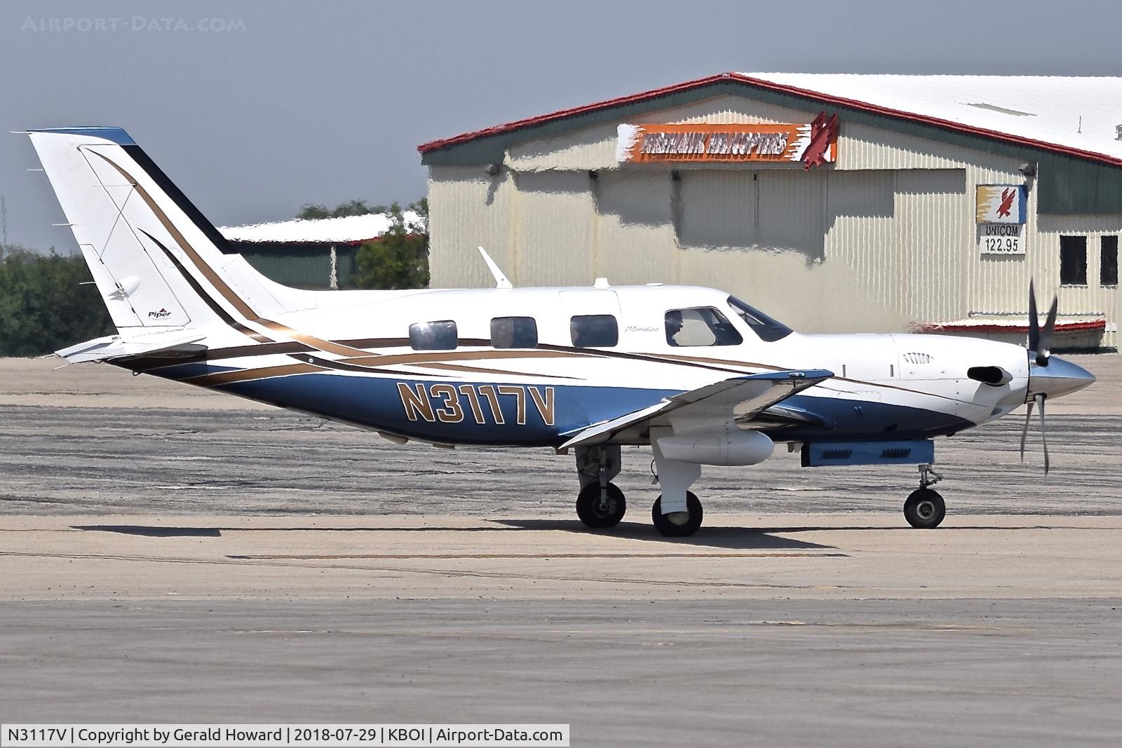 N3117V, 2005 Piper PA-46-500TP C/N 4697234, Taxiing onto the north GA ramp.