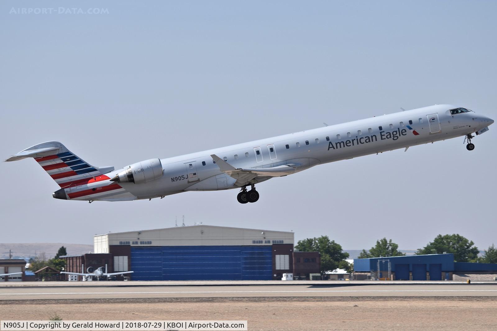 N905J, 2003 Bombardier CRJ-900 (CL-600-2D24) C/N 15005, Take off from RWY 28R.