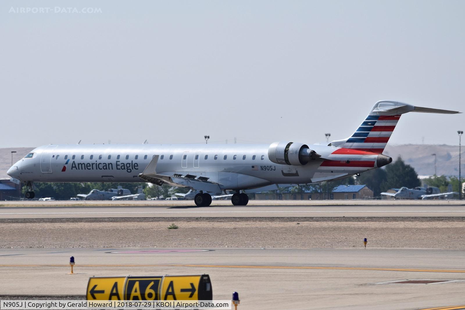 N905J, 2003 Bombardier CRJ-900 (CL-600-2D24) C/N 15005, Landing roll out on RWY 10L.