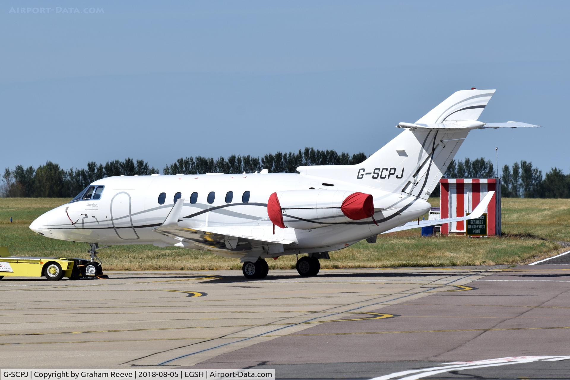 G-SCPJ, 2009 Hawker Beechcraft 900XP C/N HA-0140, Under tow at Norwich.