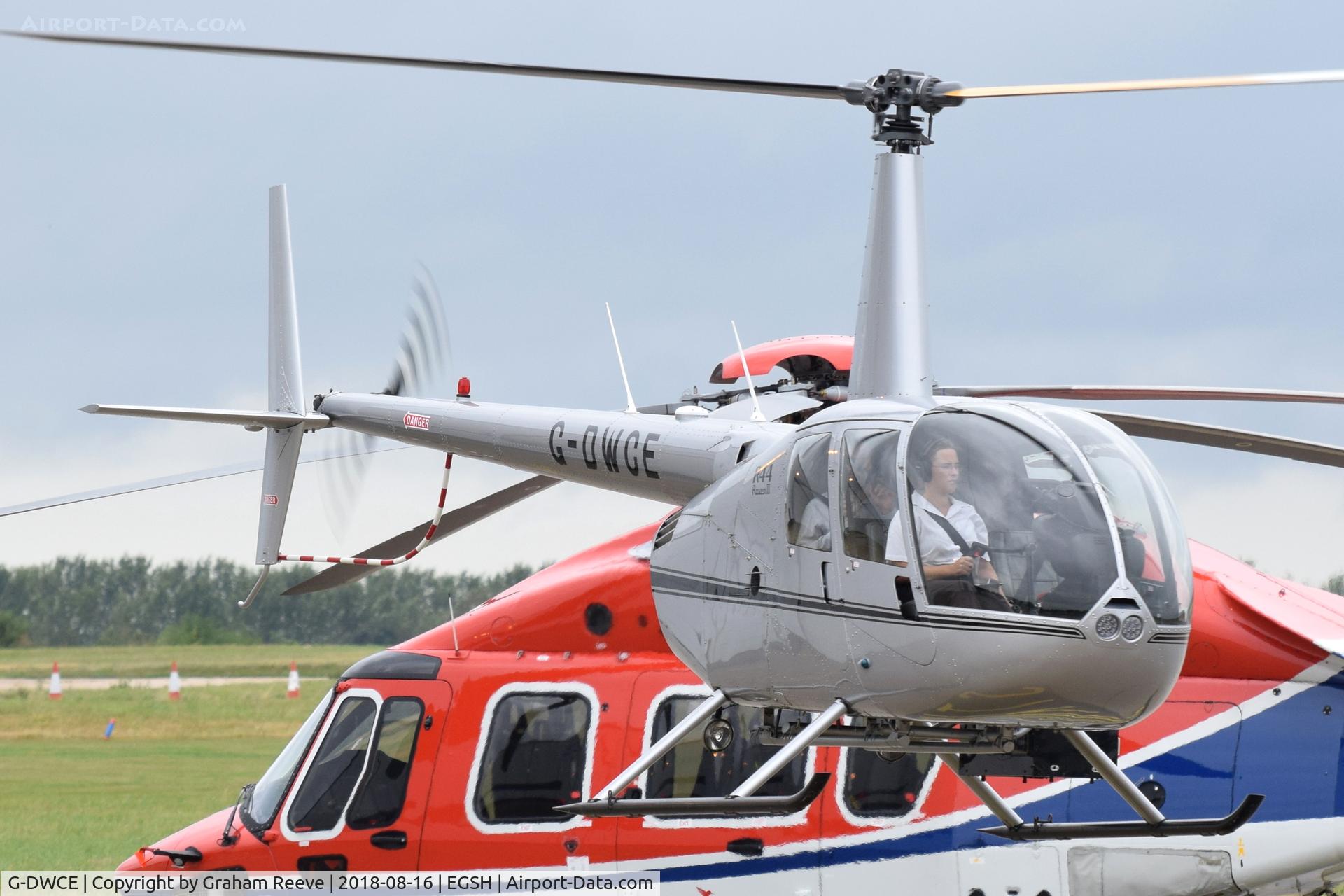 G-DWCE, 2006 Robinson R44 Raven II C/N 11511, Departing from Norwich.