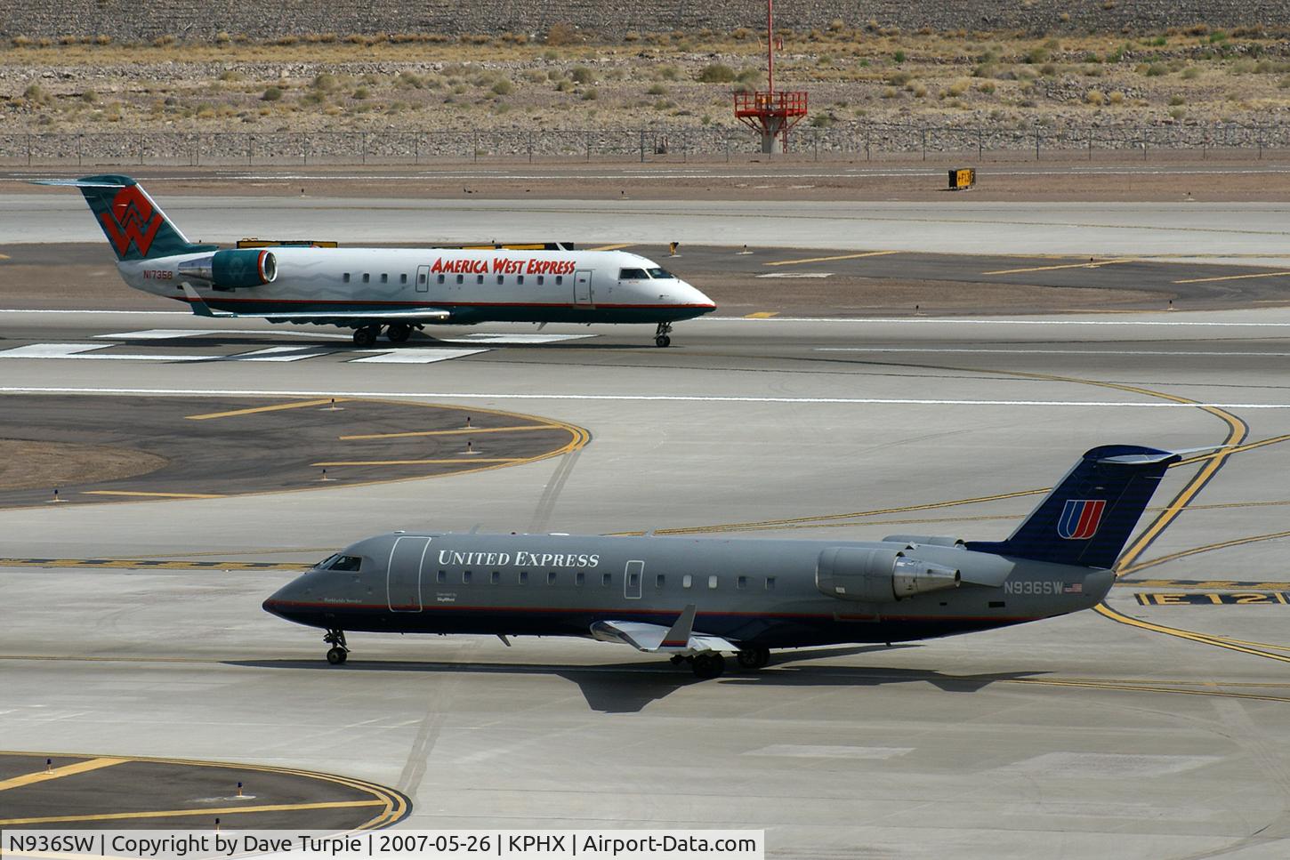 N936SW, 2002 Bombardier CRJ-200LR (CL-600-2B19) C/N 7726, Two liveries that will never be seen again.
